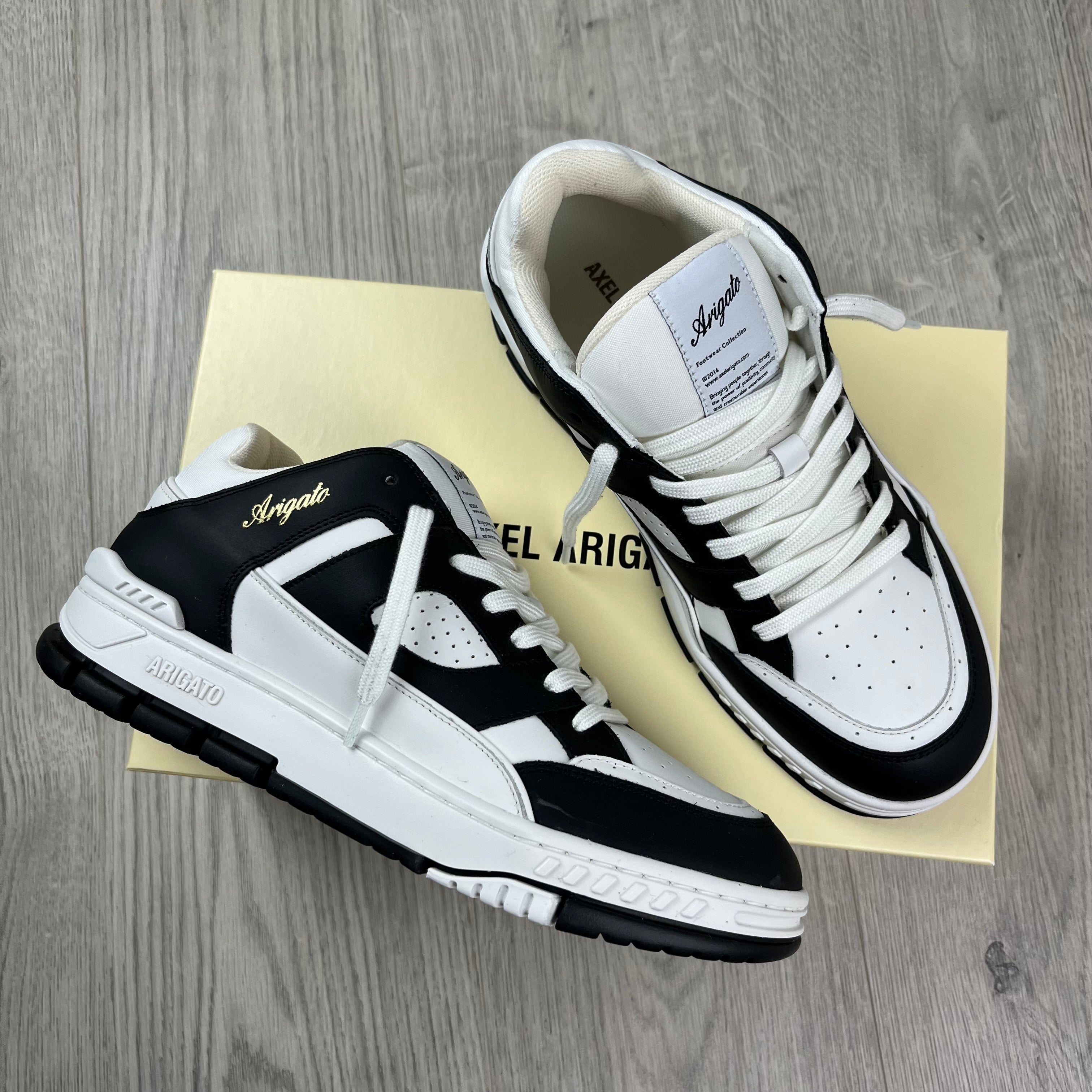 Men's Axel Arigato Arena Lo Sneakers in White/Black. On sale at Open Attire.