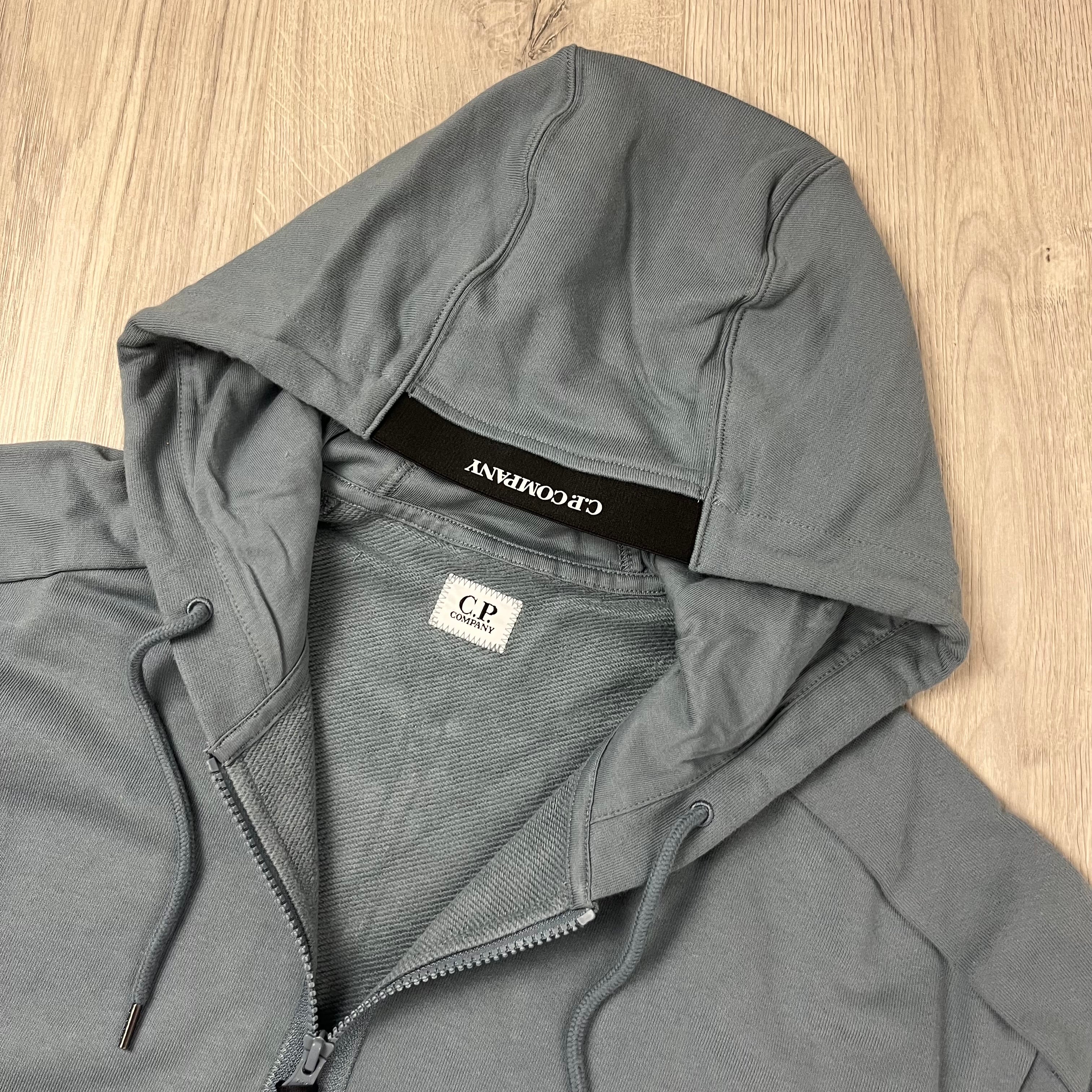 CP Company Diagonal Raised Fleece Zipped Hoodie in Stormy Weather. On Sale at Open Attire.