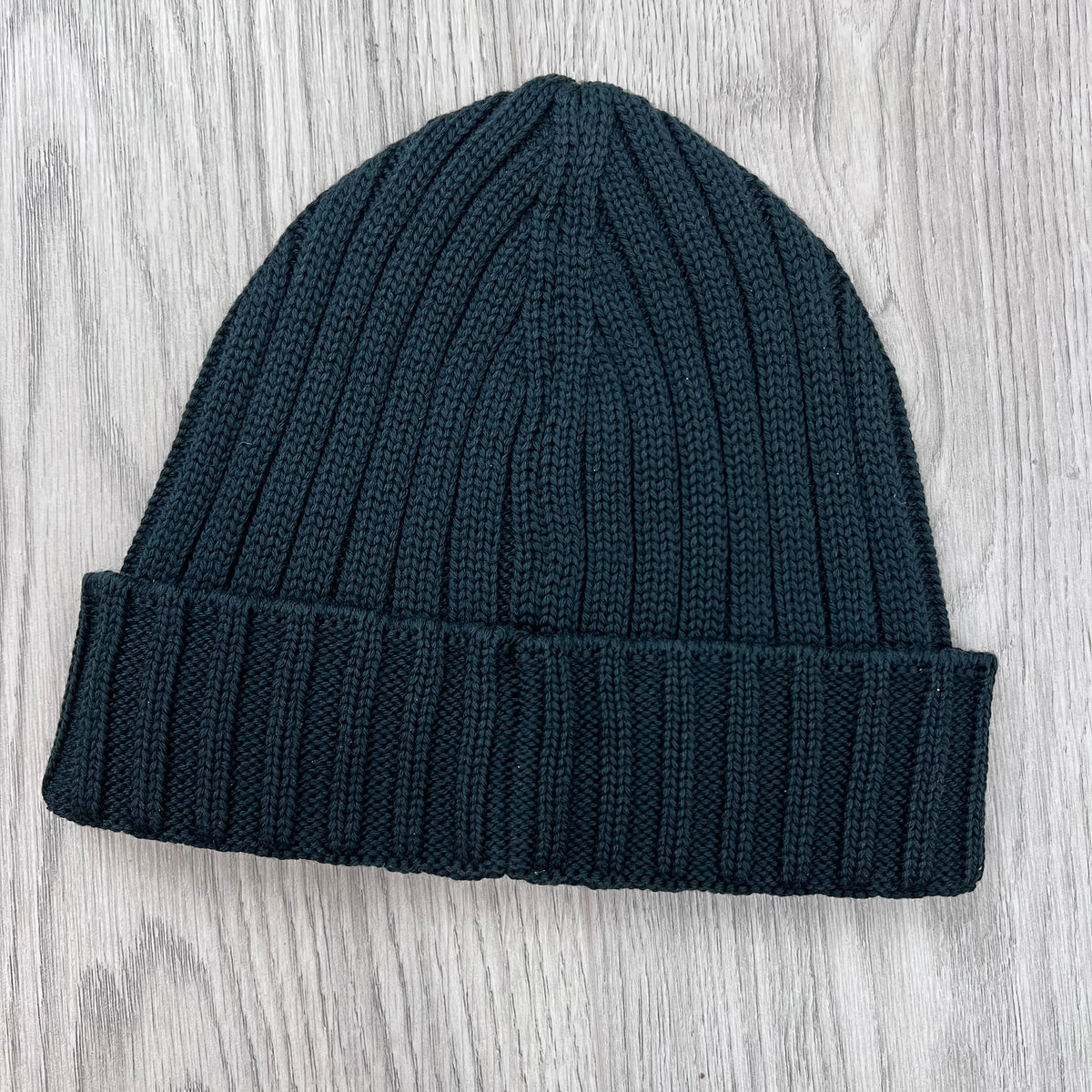 Rear view of the CP Company Merino Wool Patch Beanie in Ponderosa Pine .