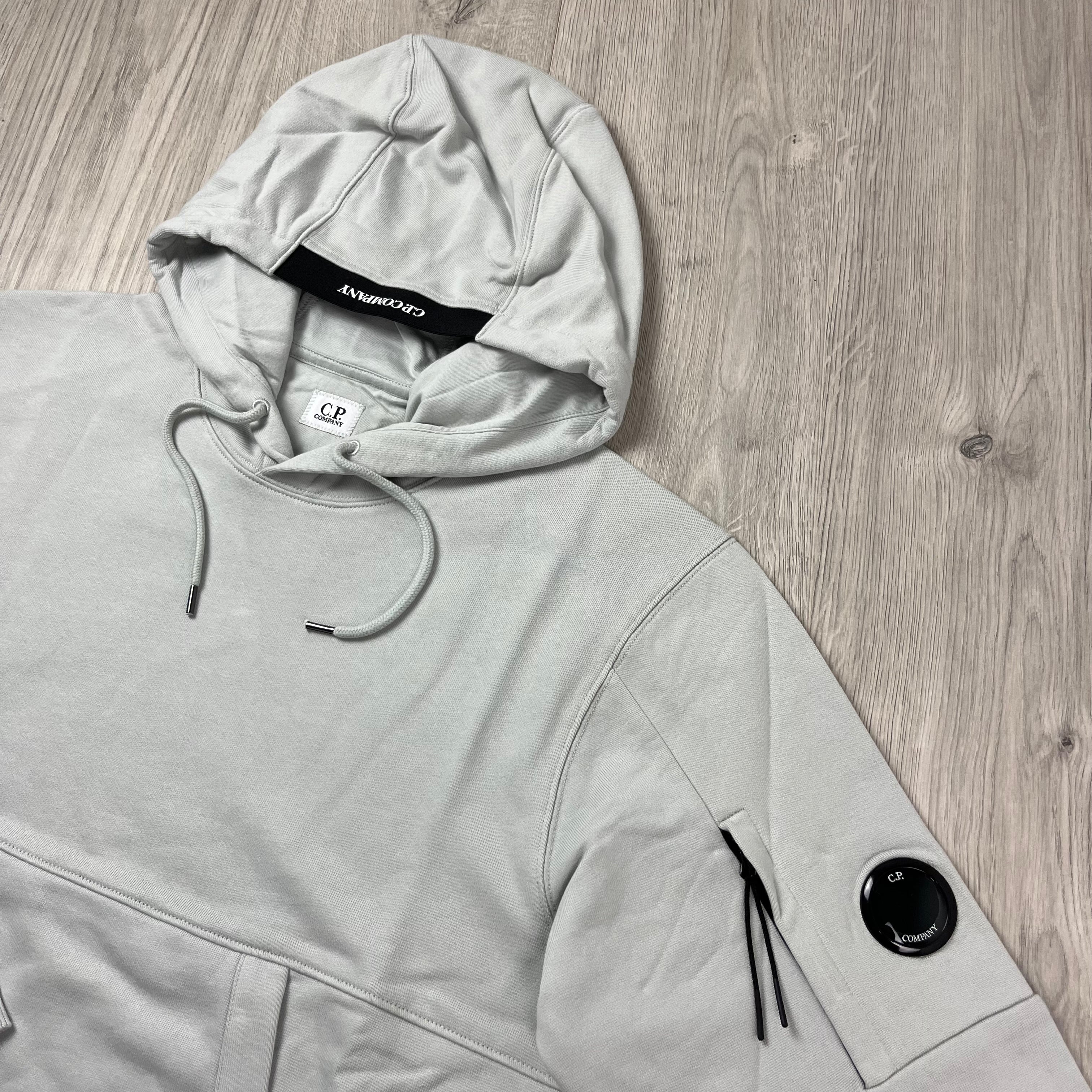 CP Company Diagonal Raised Fleece Hoodie in Blue Fox. On sale at Open Attire.