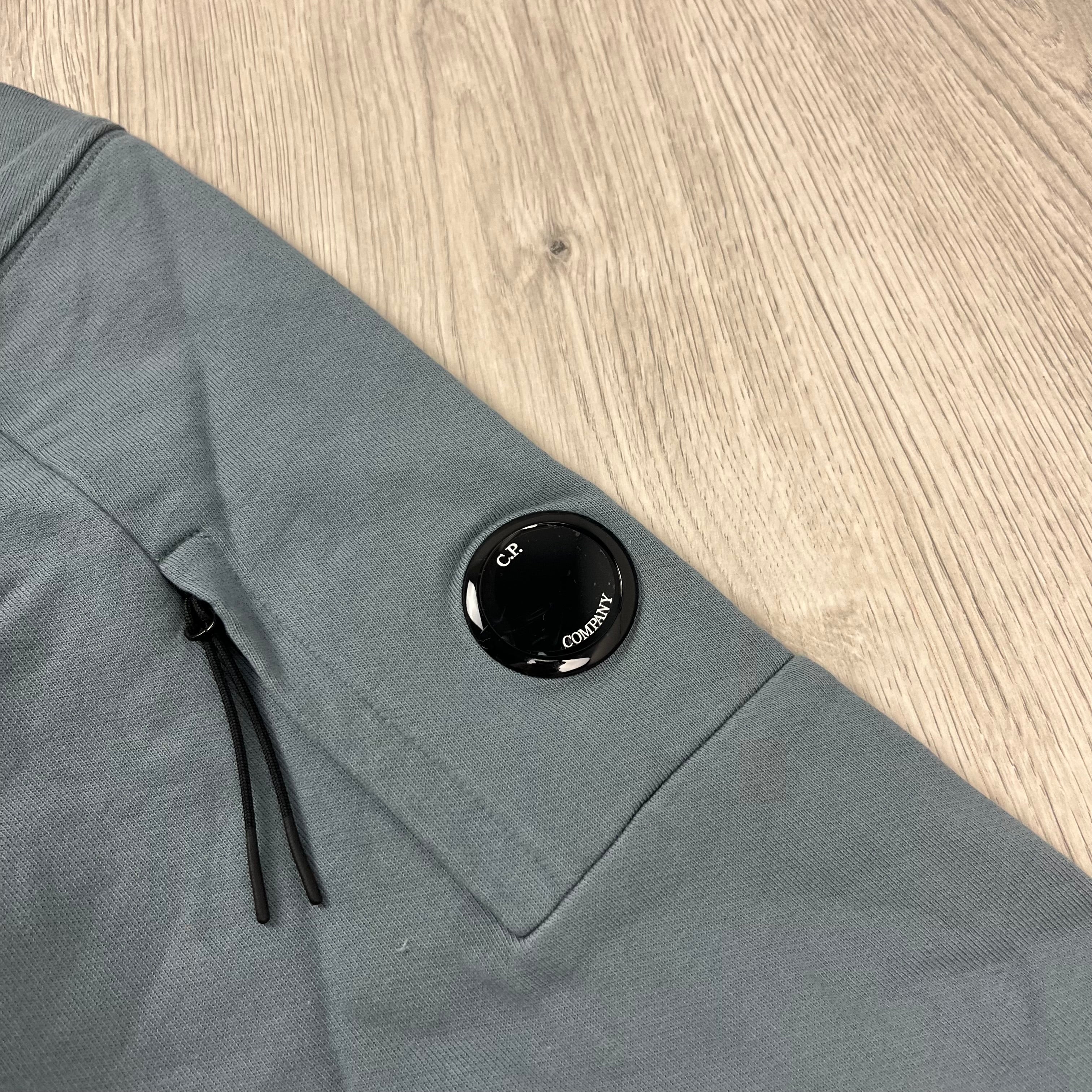 CP Company Diagonal Raised Fleece Hoodie in Stormy Weather. On sale at Open Attire.