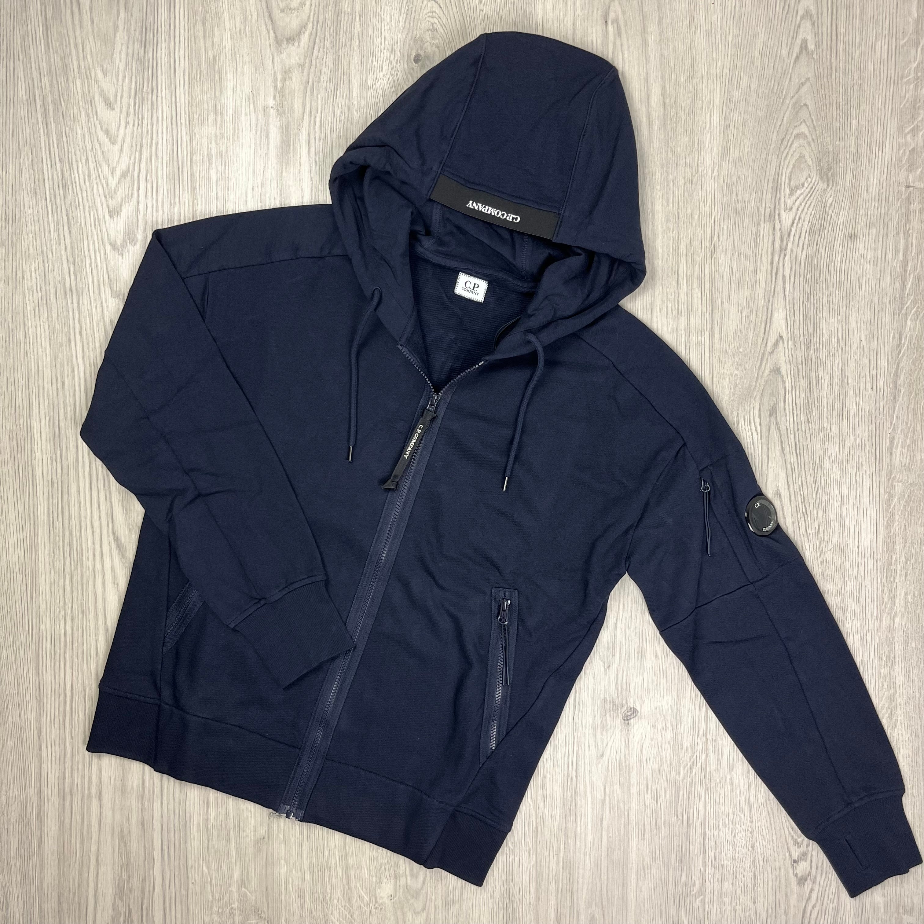 CP Company Diagonal Raised Fleece Zip Hoodie in Total Eclipse Navy Blue. On Sale at Open Attire.