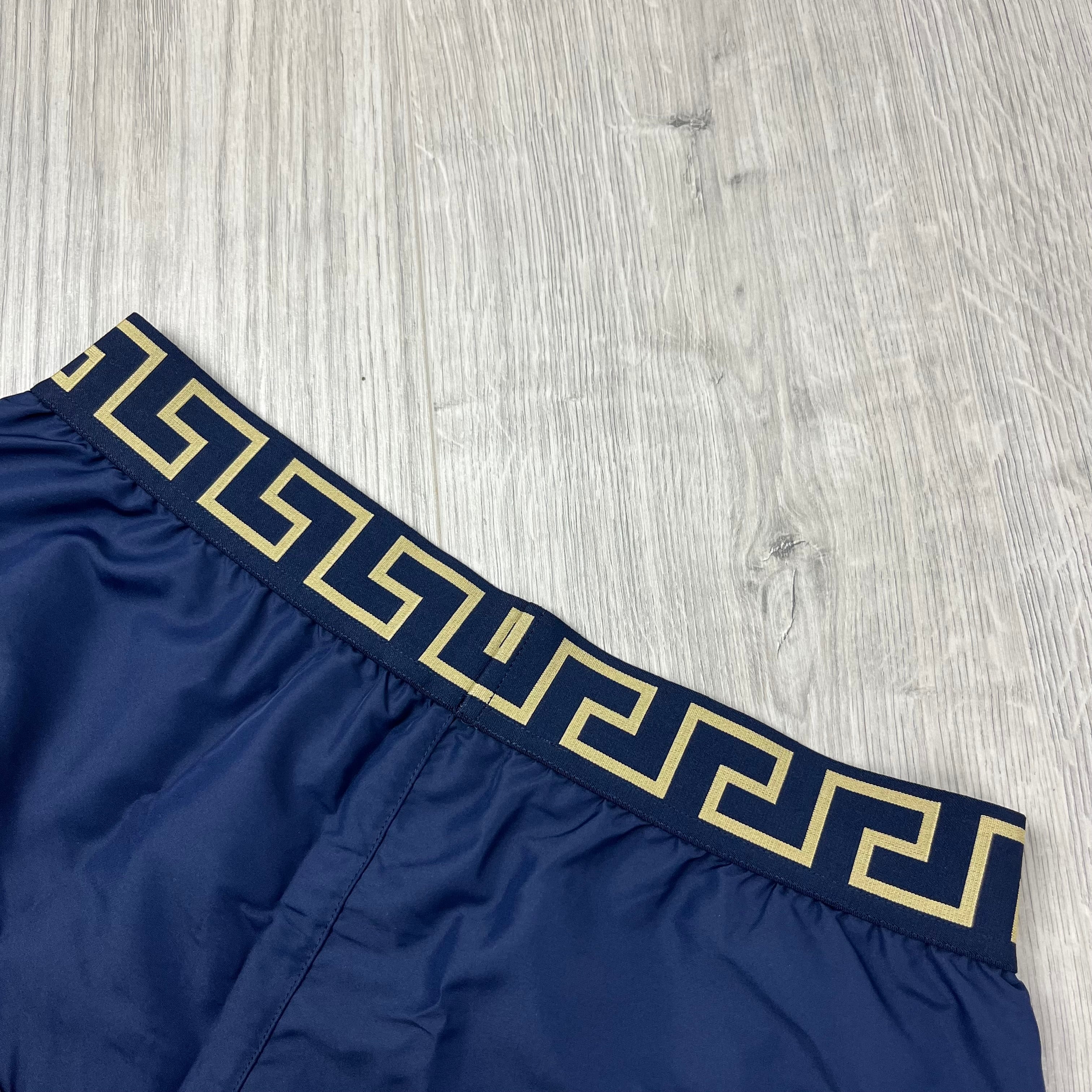 Versace Greca Swim Shorts in Navy Blue. On sale at Open Attire