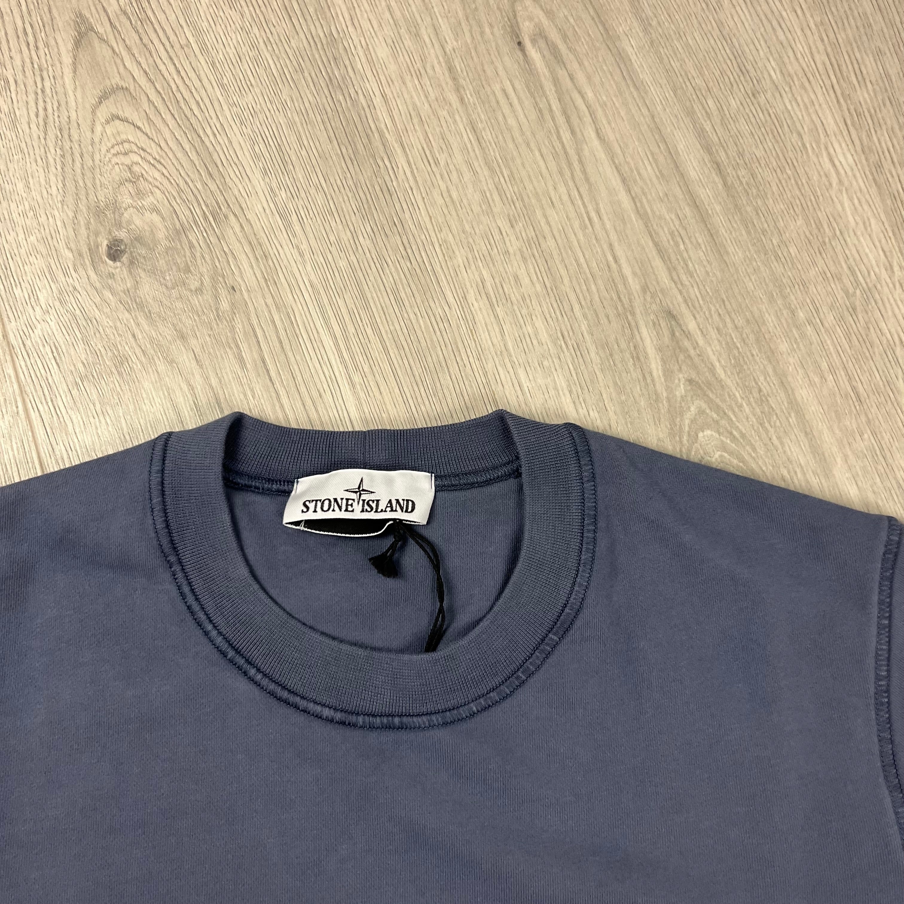 Stone Island Sweatshirt in Mid Blue. On sale at Open Attire.