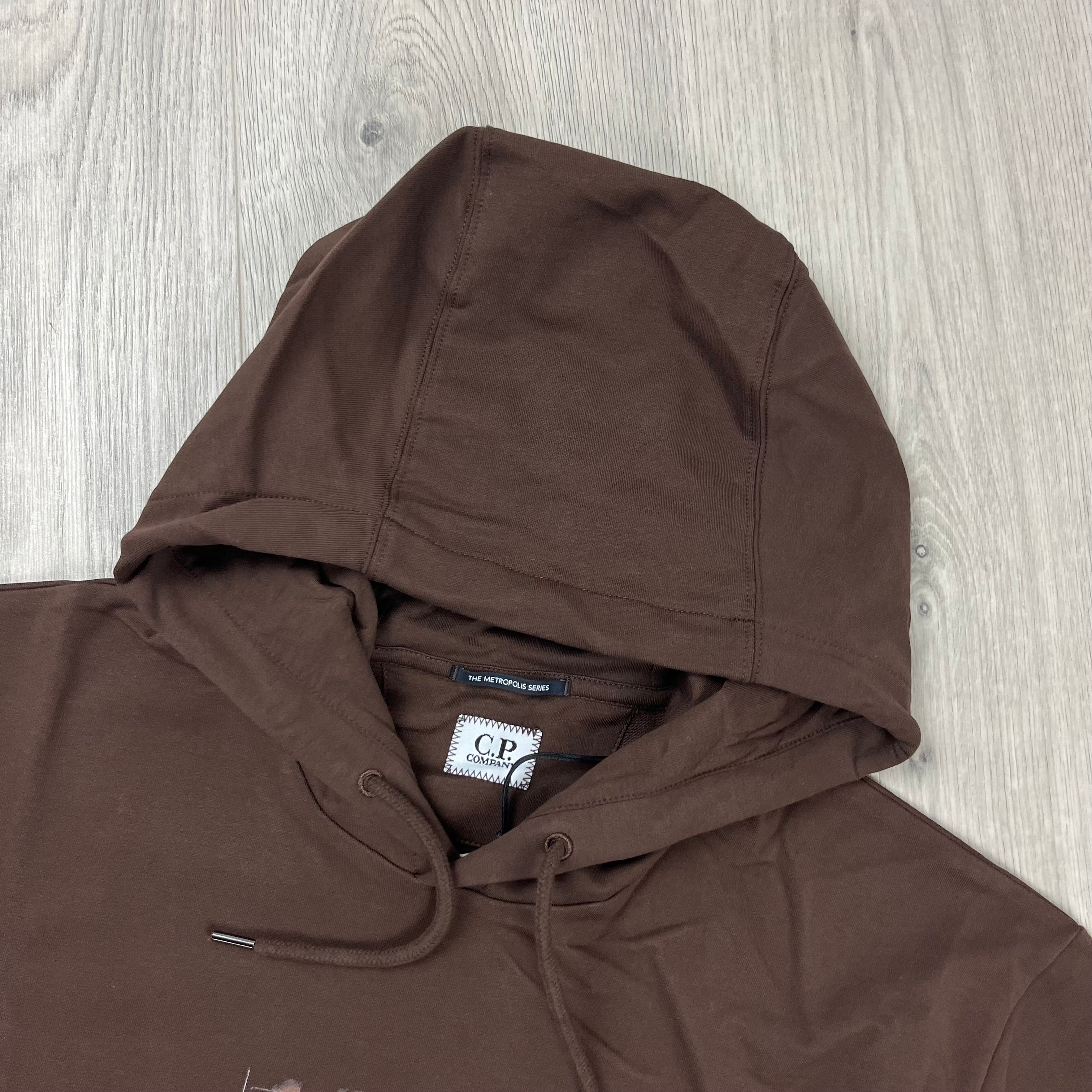 CP Company Metropolis Logo Hoodie in Rum Raisin. On sale at Open Attire.