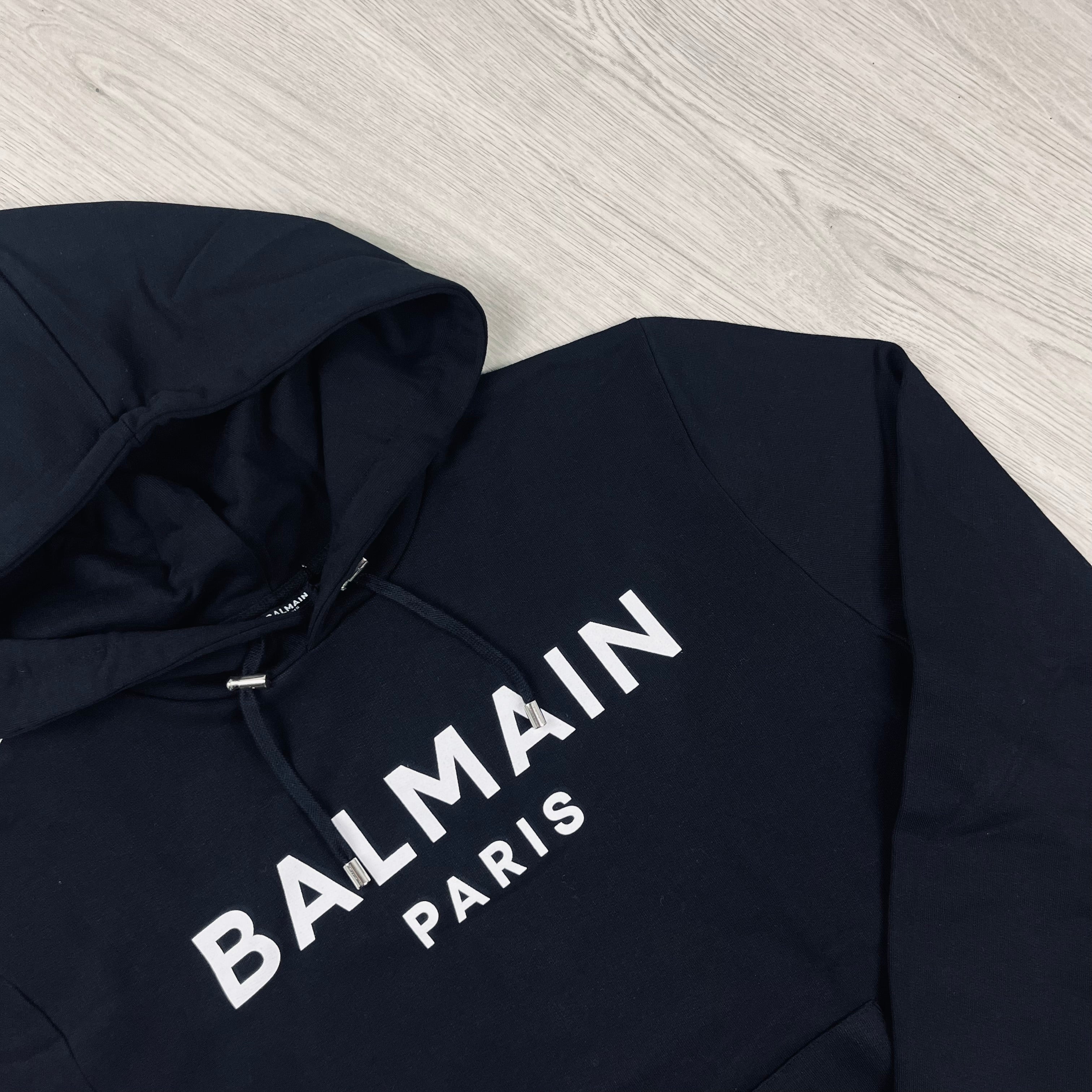 Balmain Printed Hoodie in Black. On sale at Open Attire.