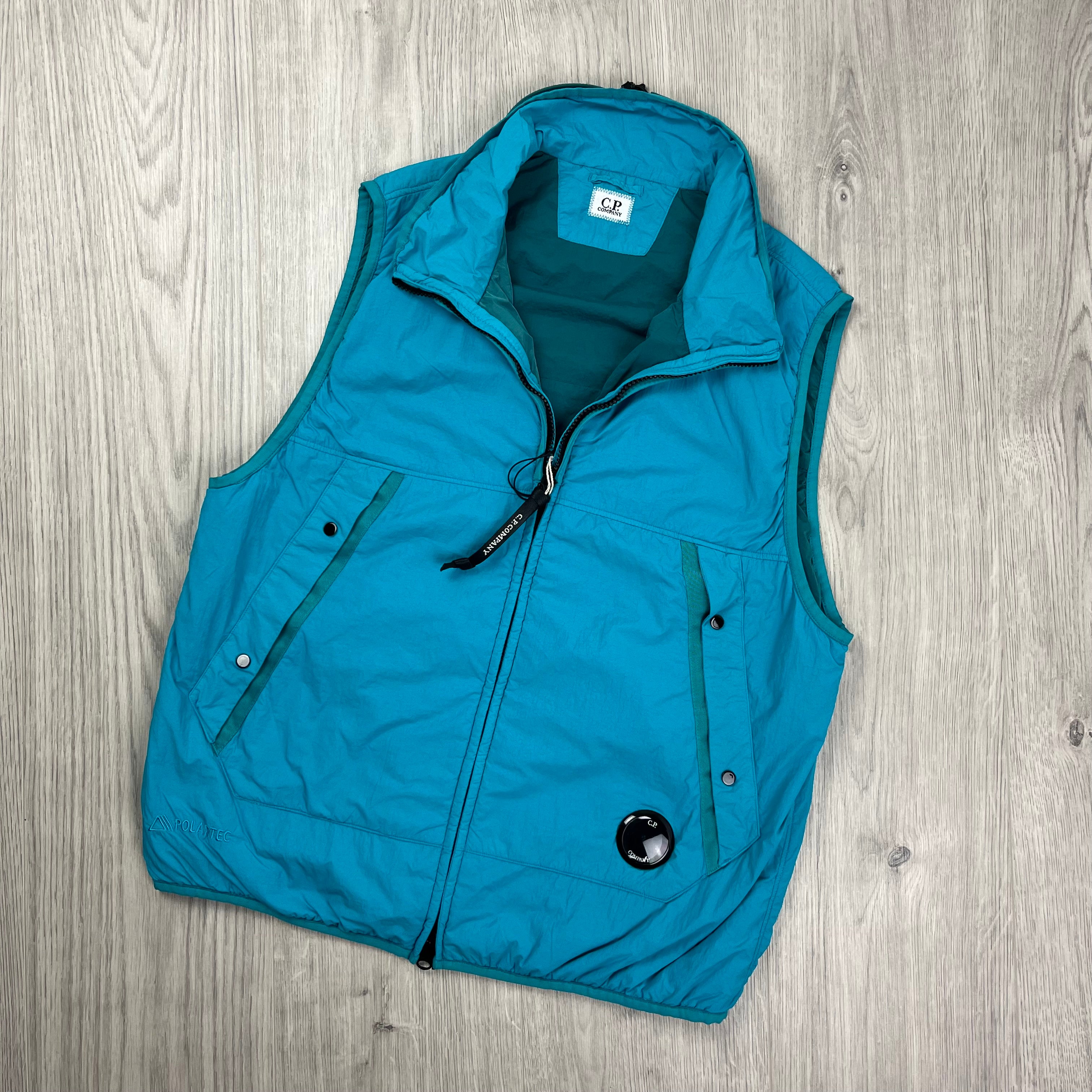 CP Company G.D.P. gilet in Tile Blue. On sale at Open Attire.