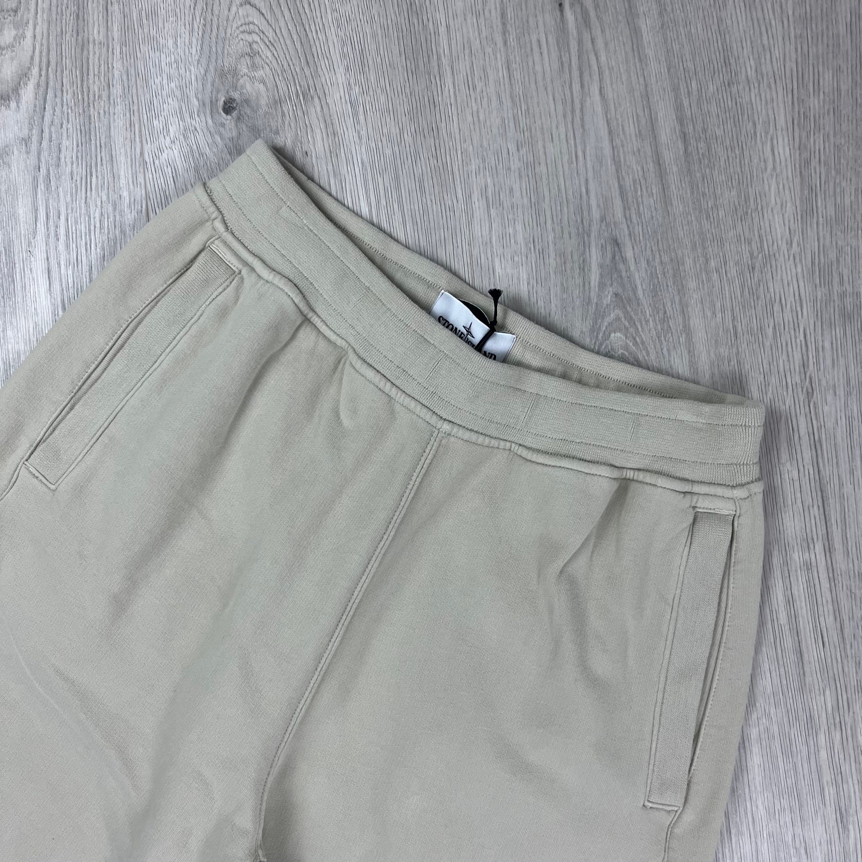 Stone Island Sweatpants in Plaster Beige. On sale at Open Attire.