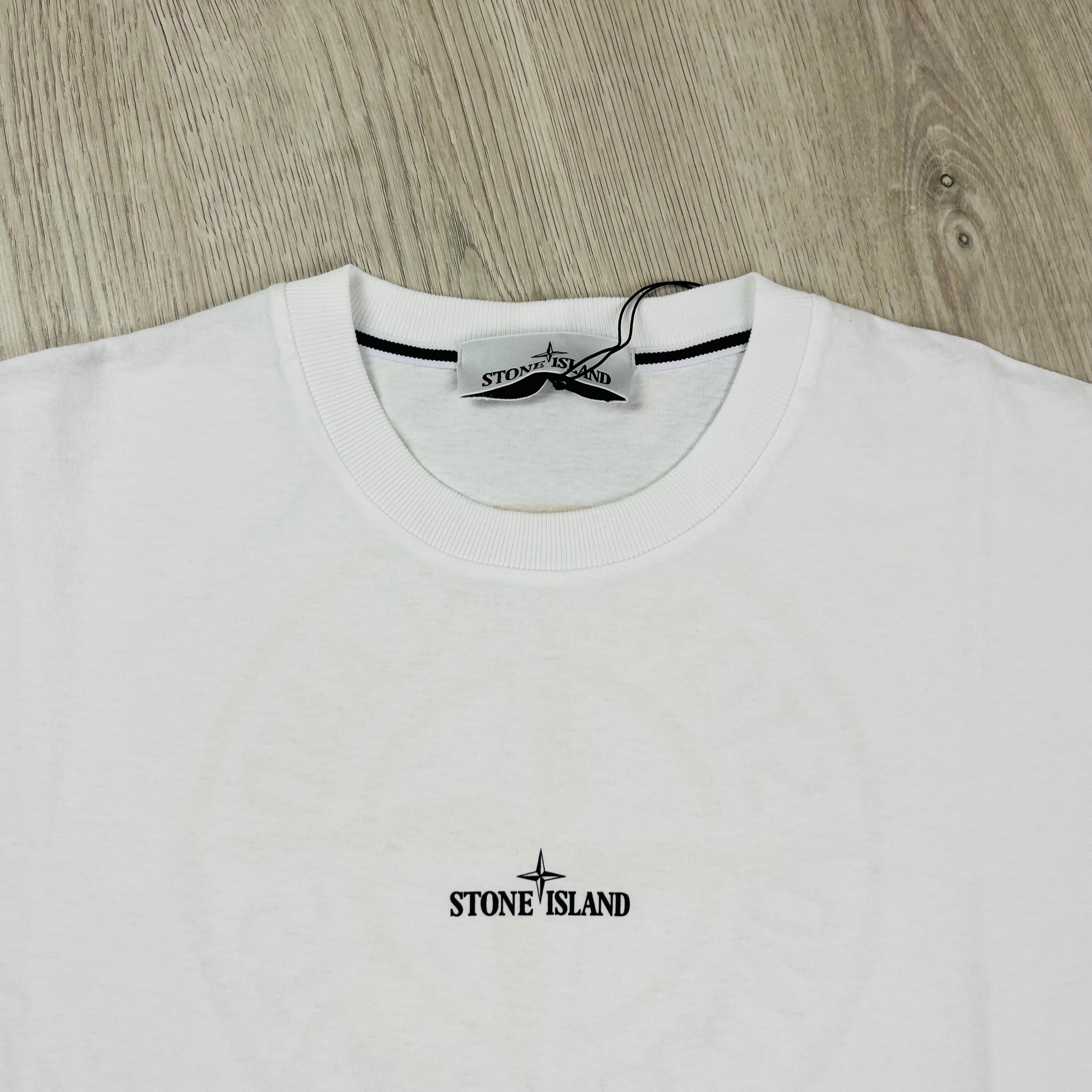 Stone Island 'Institutional Four' T-shirt in White. On sale at Open Attire.