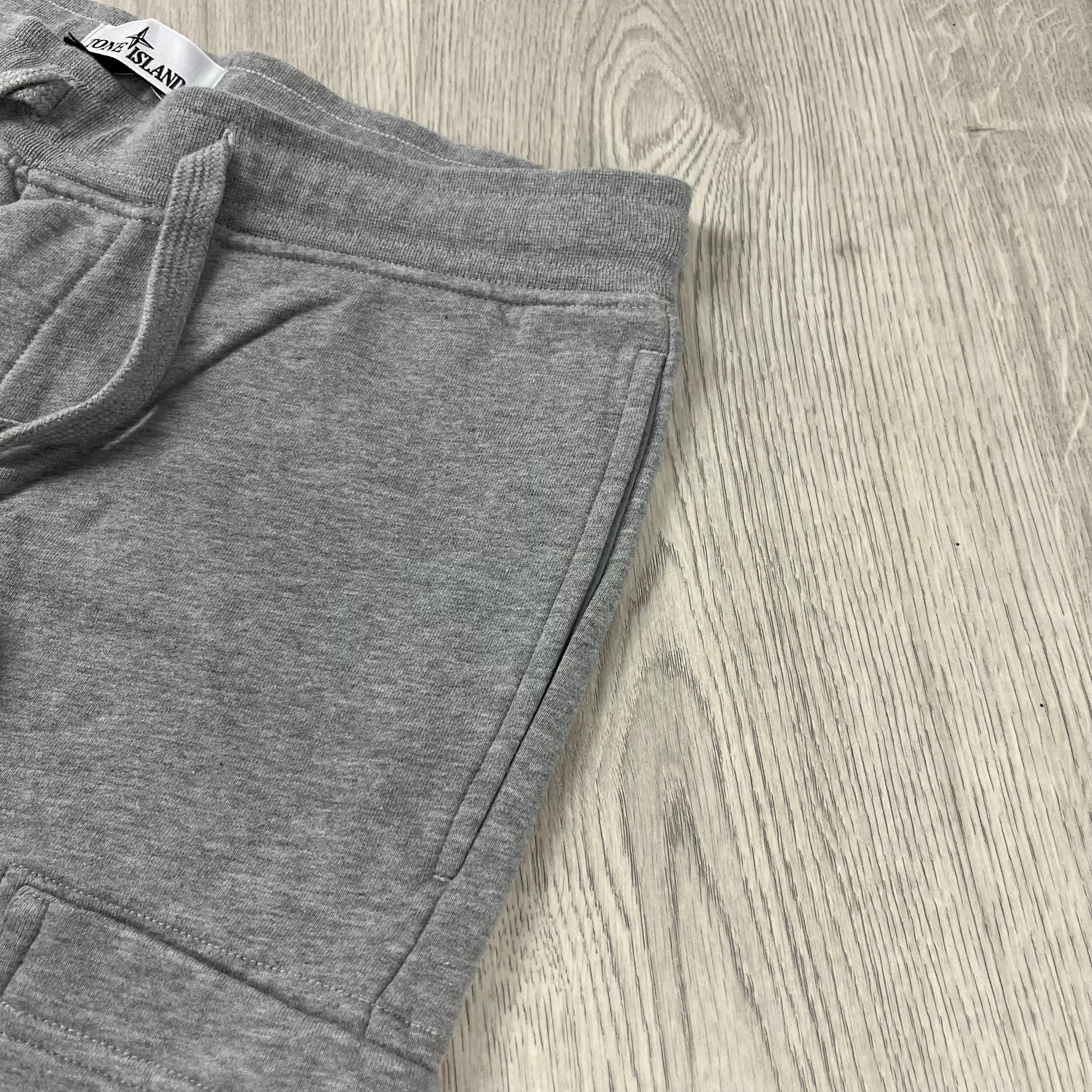 Stone Island Tapered Sweatpants in Dust Grey. On sale at Open Attire.