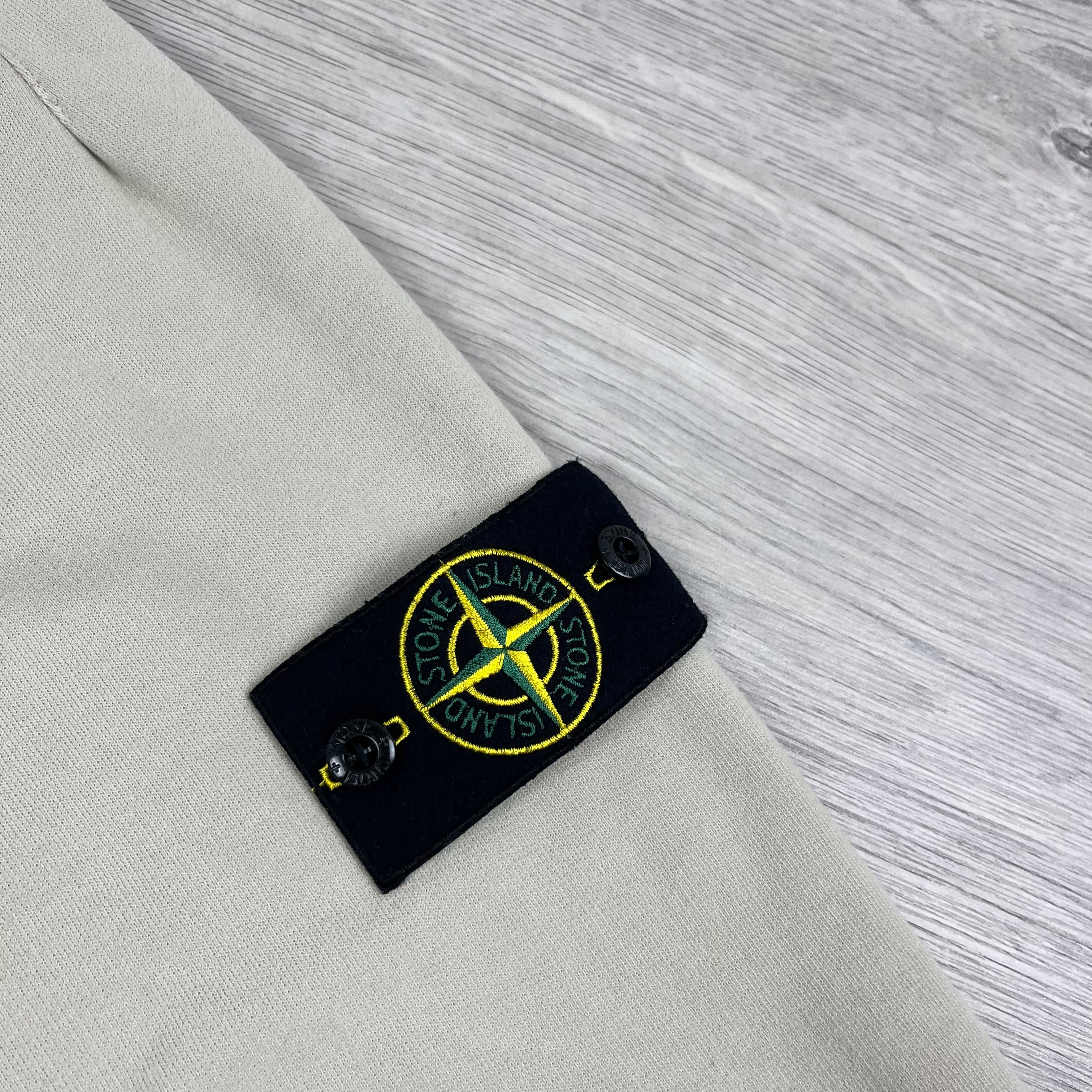 Stone Island Sweatpants in Plaster Beige. On sale at Open Attire.