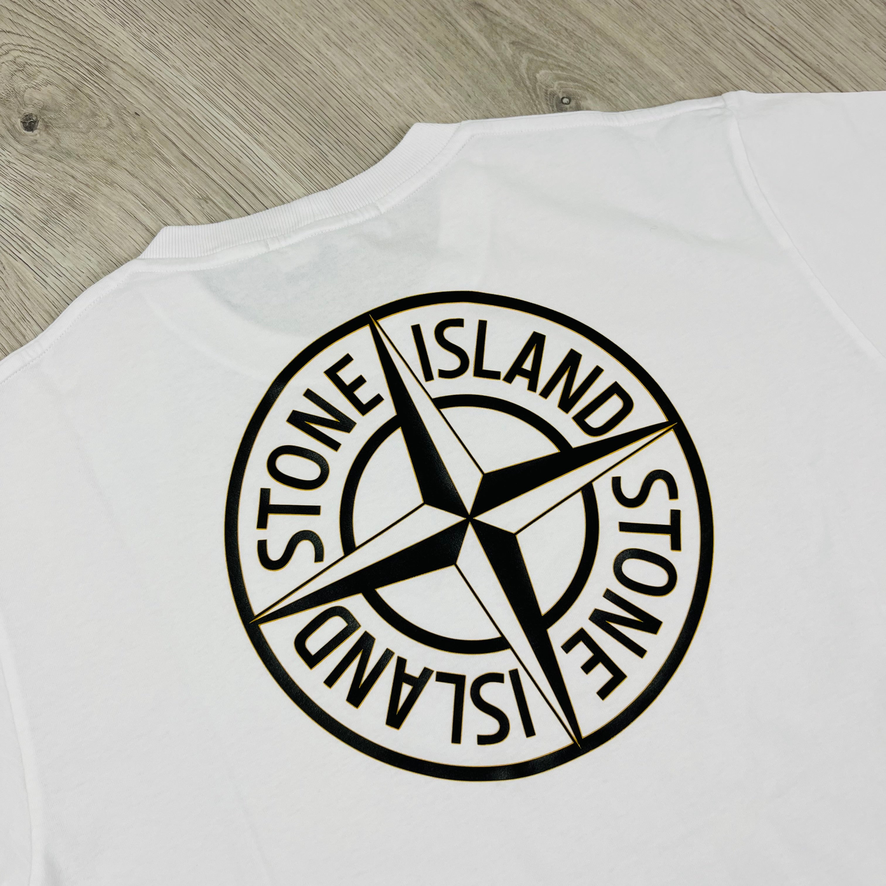 Stone Island 'Institutional Four' T-shirt in White. On sale at Open Attire.