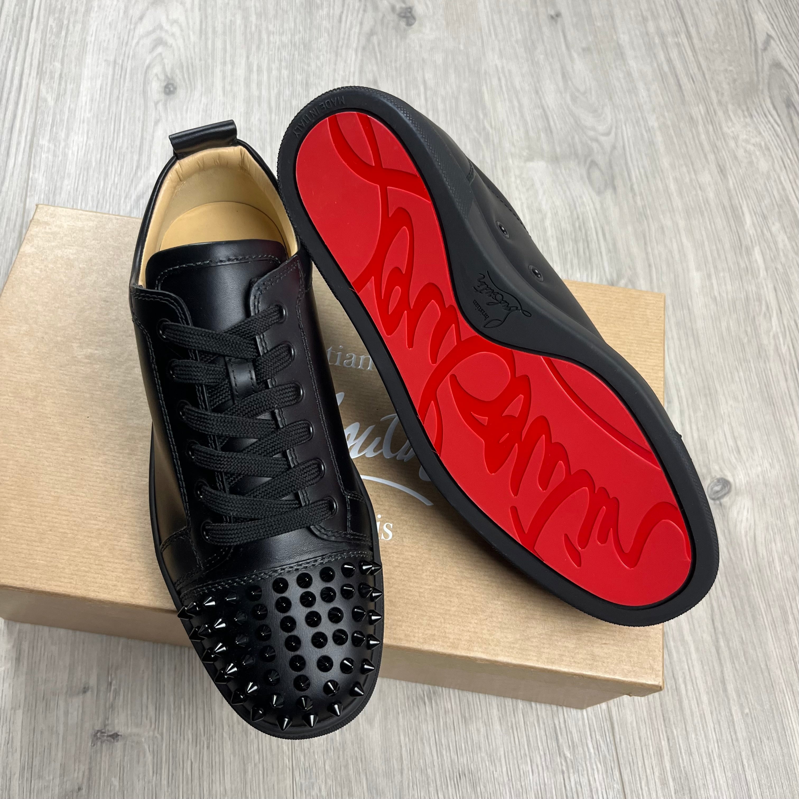 Christian Louboutin Louis Junior Sneakers in Black. On sale at Open Attire.