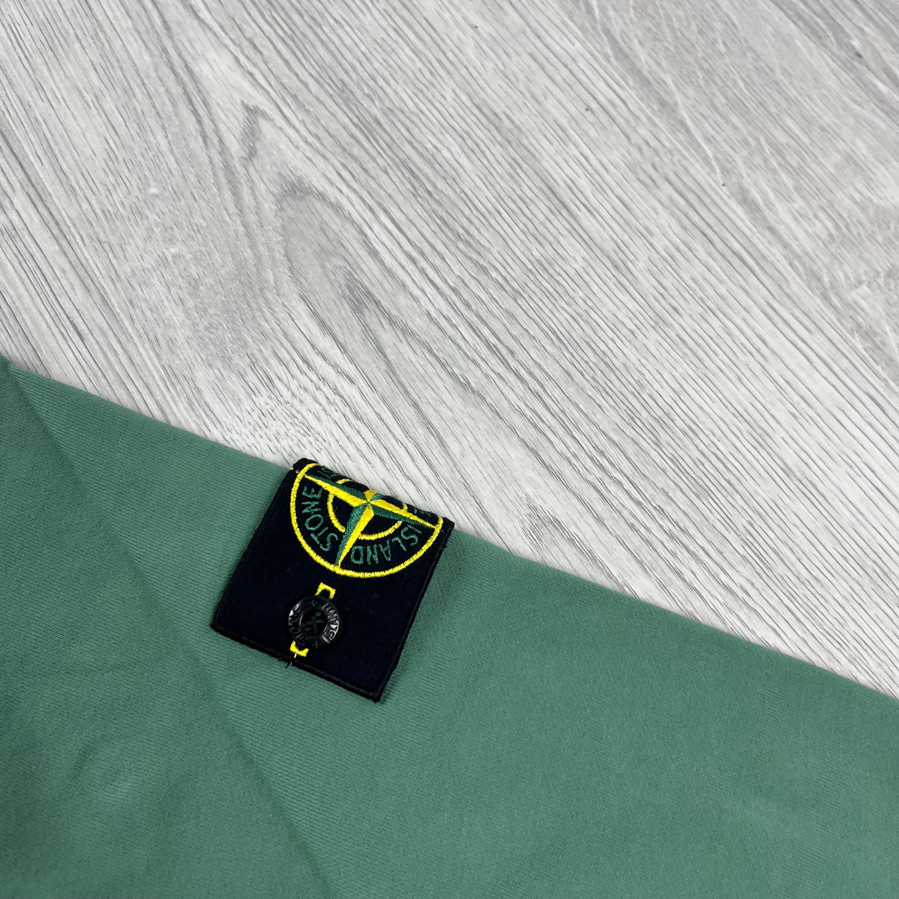 Stone Island Pullover Hoodie in Sage Green. On sale at Open Attire.