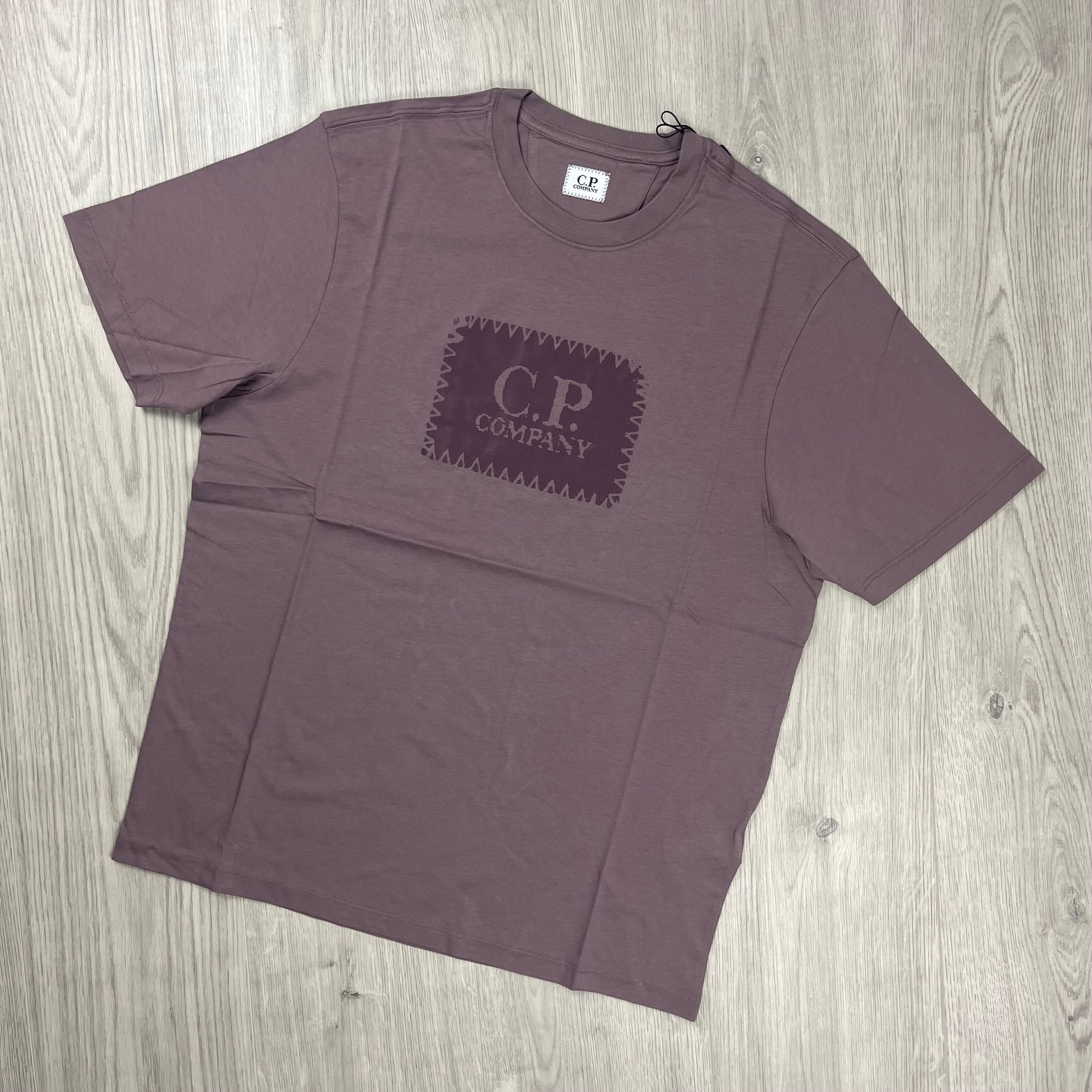 CP Company Stamp Logo T-shirt in Purple Dove. On sale at Open Attire.