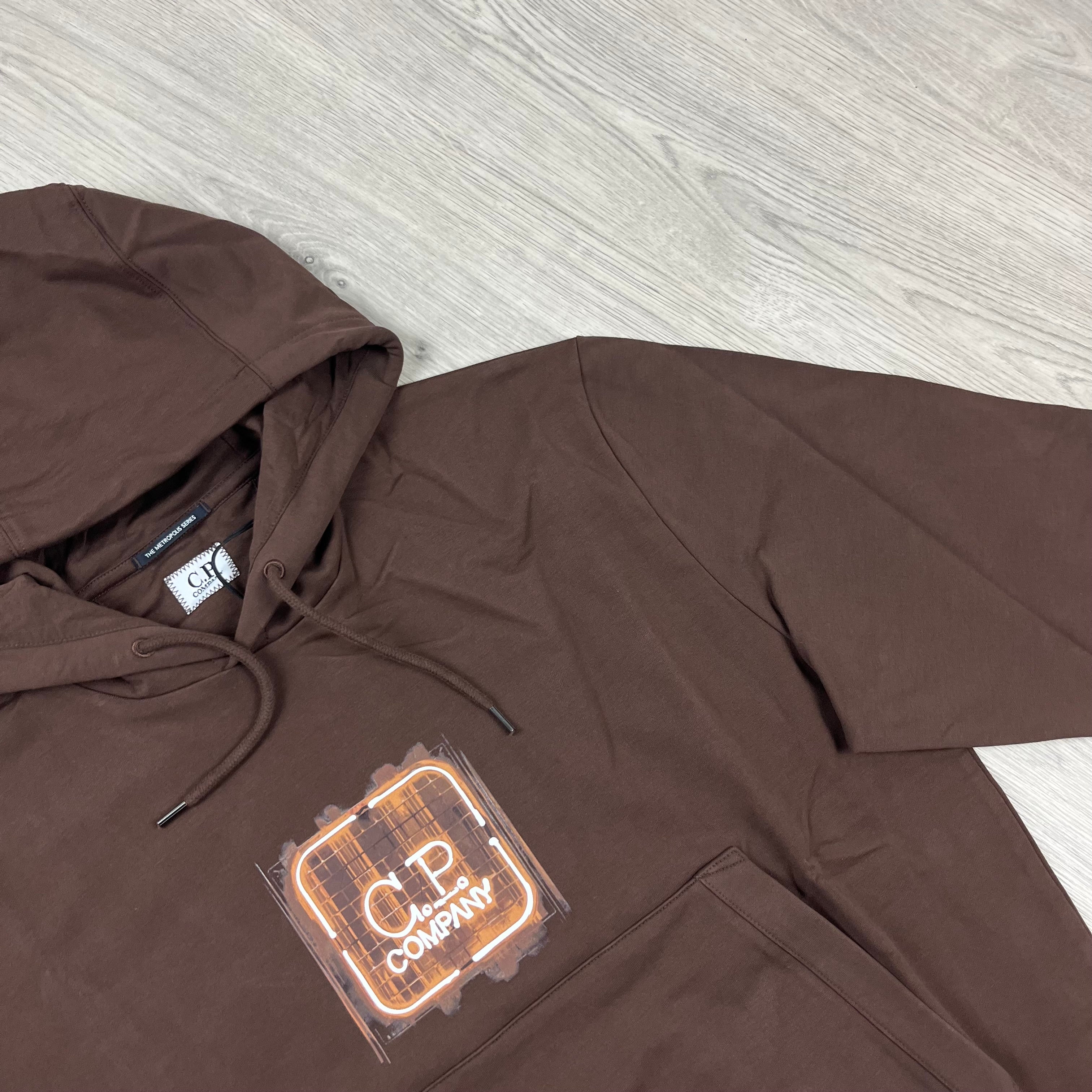 CP Company Metropolis Logo Hoodie in Rum Raisin. On sale at Open Attire.