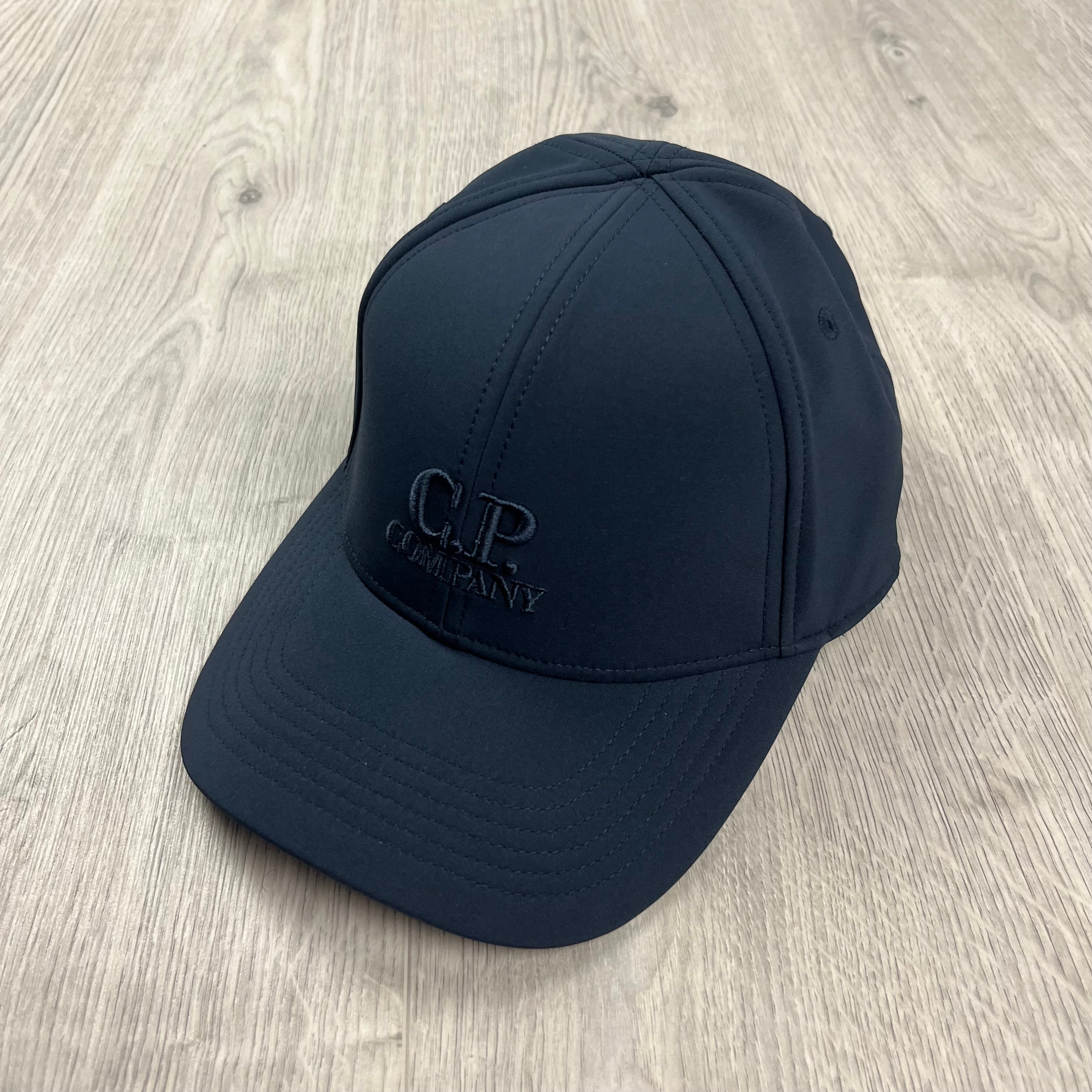 CP Company Shell-R Baseball Cap in Total Eclipse Navy Blue. On sale at Open Attire.