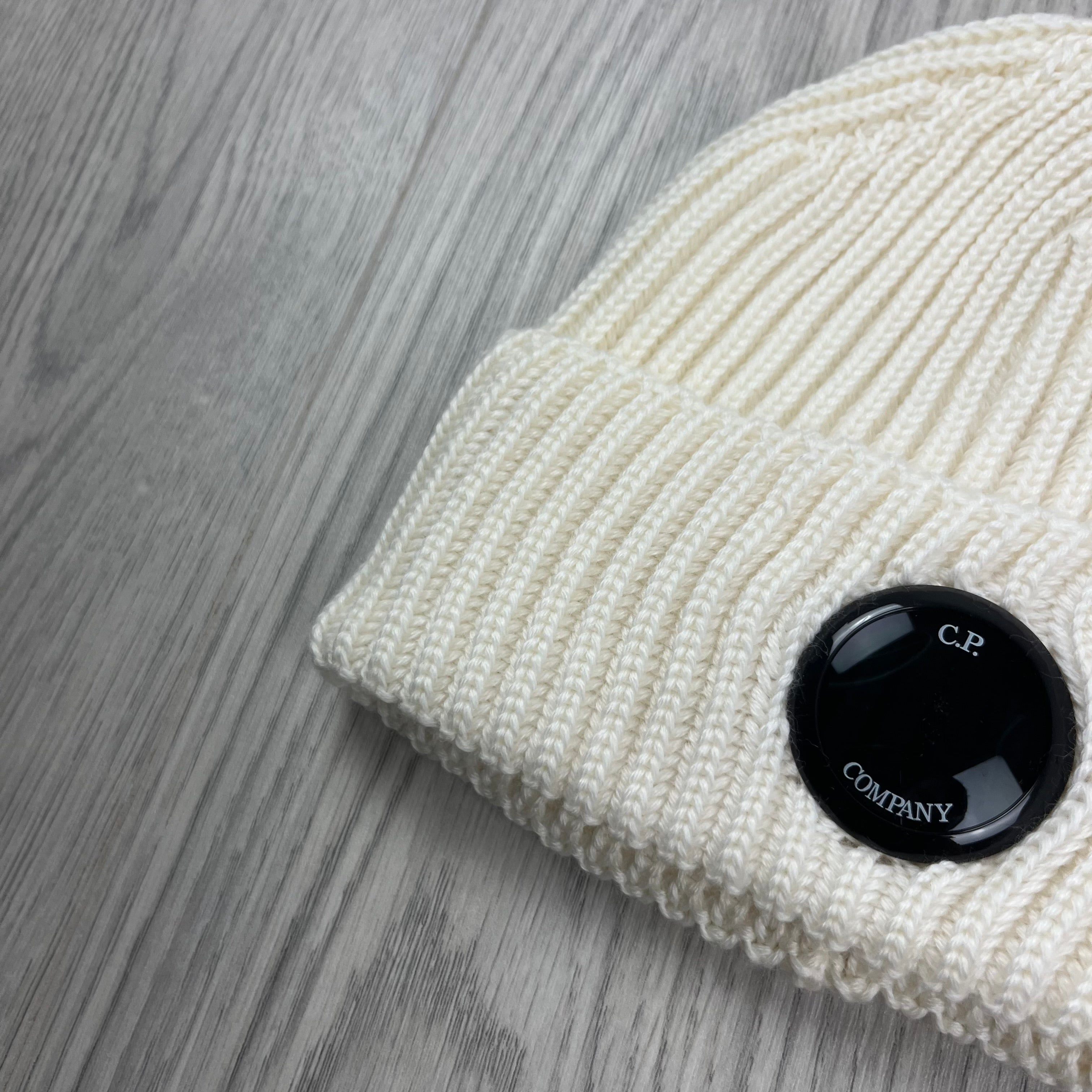 CP Company Merino Wool Lens Beanie in Gauze White. On sale at Open Attire.