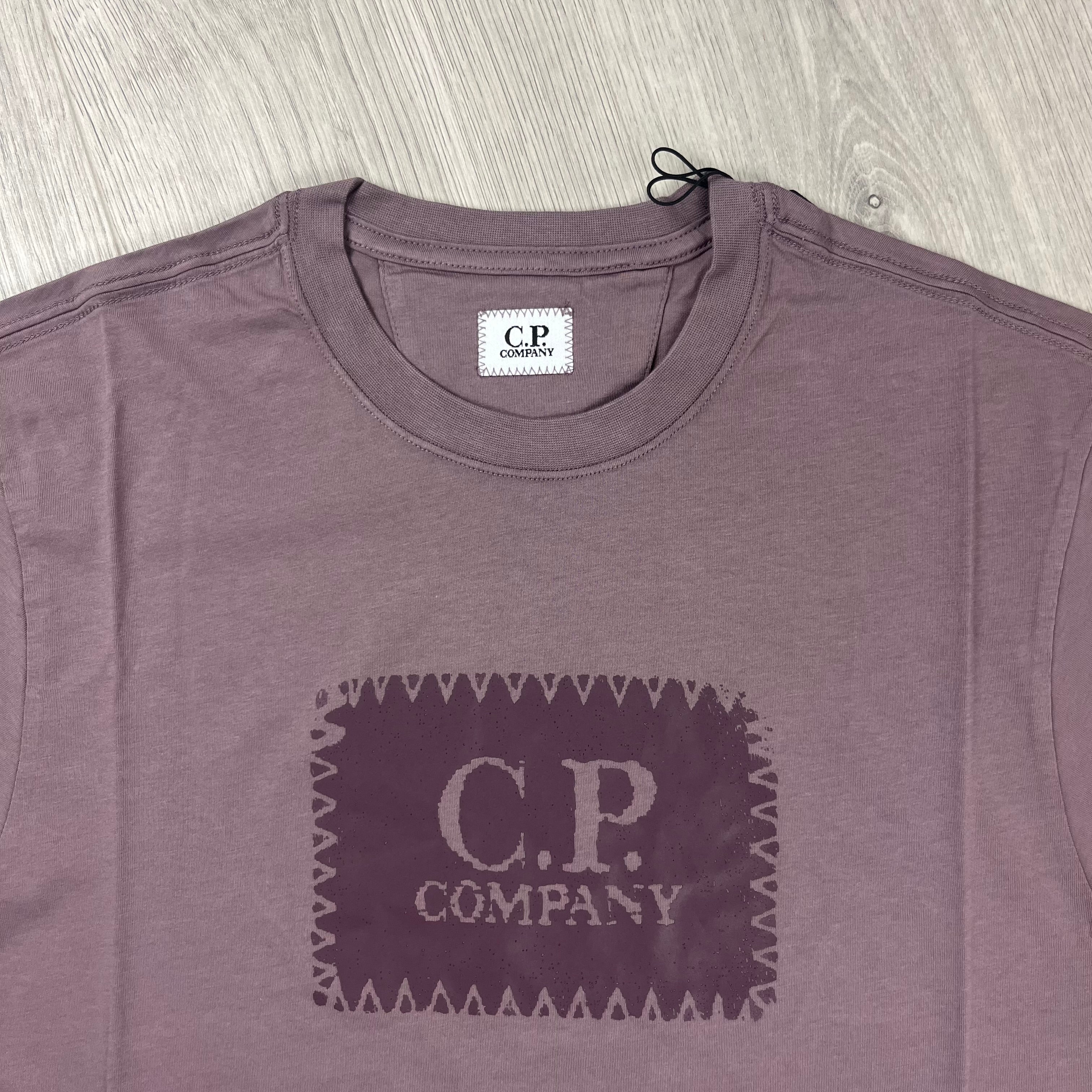 CP Company Stamp Logo T-shirt in Purple Dove. On sale at Open Attire.