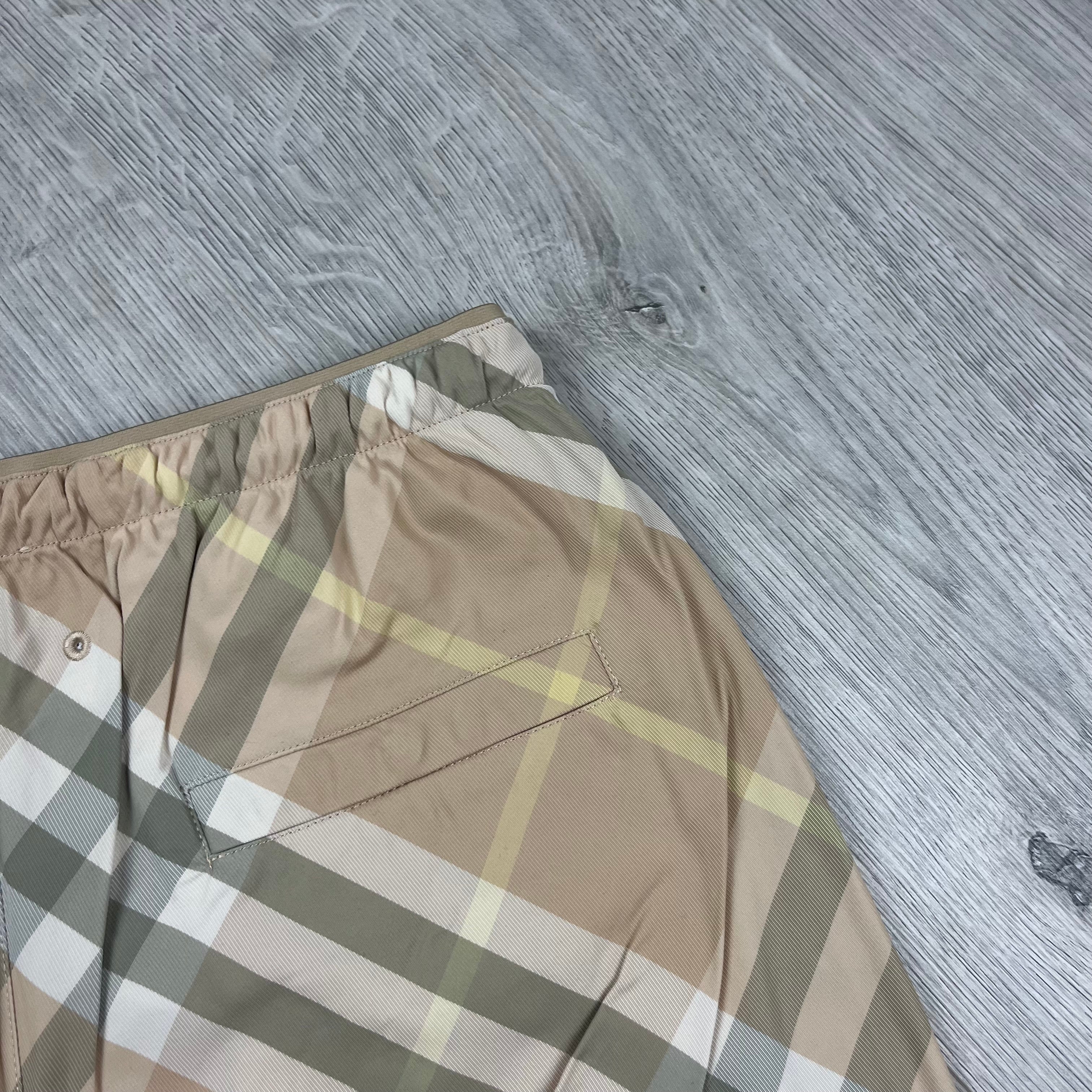 Burberry EKD Check Swim Shorts in Flax Beige. On sale at Open Attire.