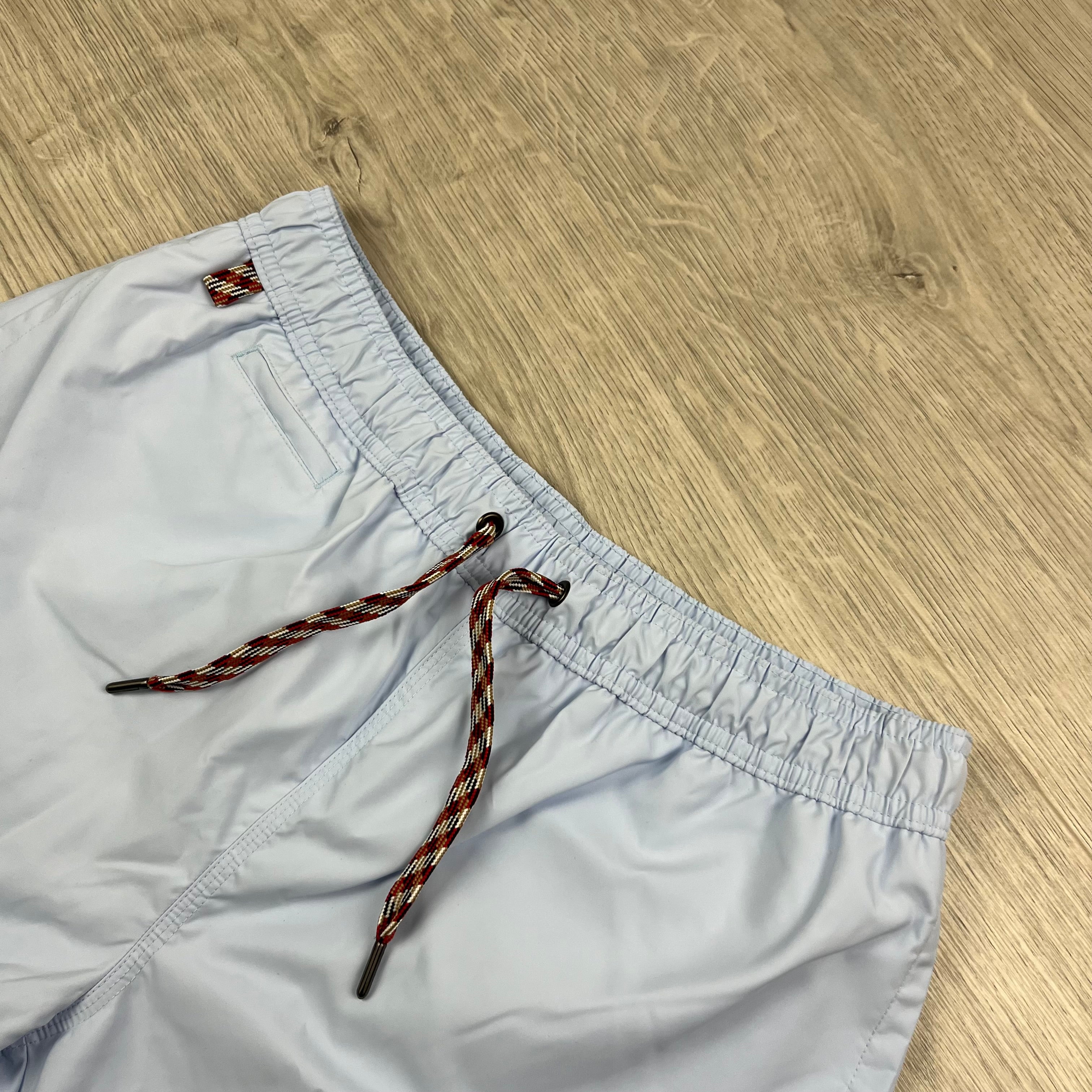 Burberry 'Greenford' Swim Shorts in Pale Blue. On sale at Open Attire.