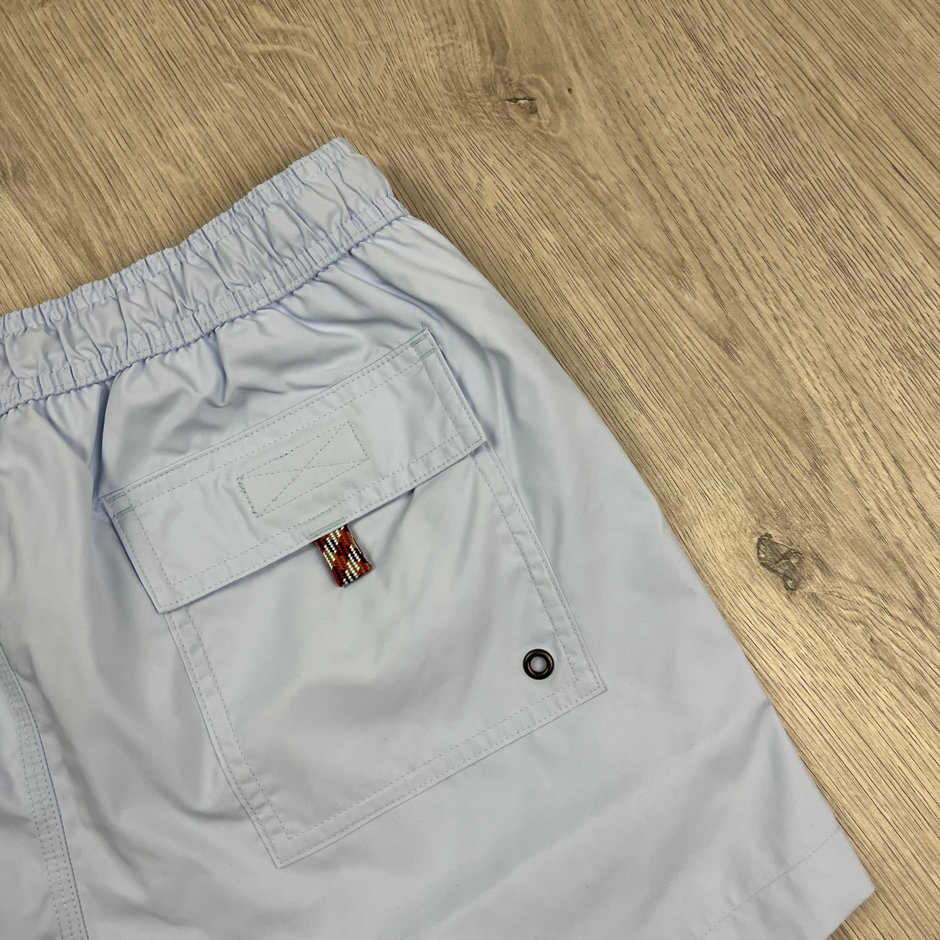 Burberry 'Greenford' Swim Shorts in Pale Blue. On sale at Open Attire.