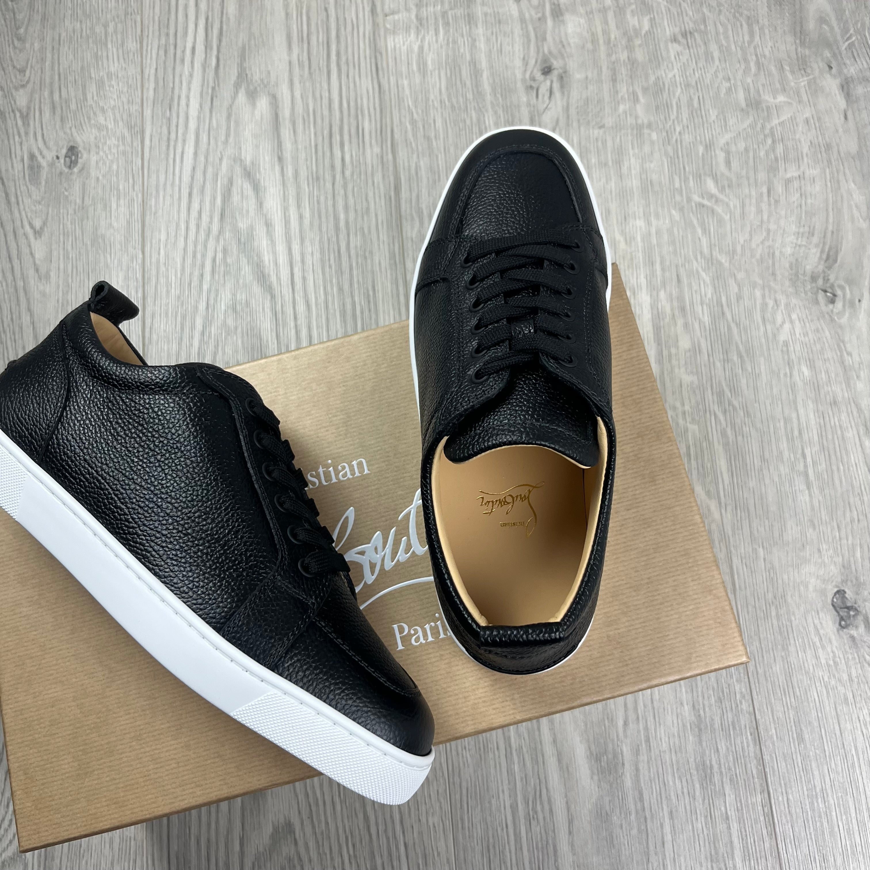 Christian Louboutin Rantulow Sneakers in Black. On sale at Open Attire. 