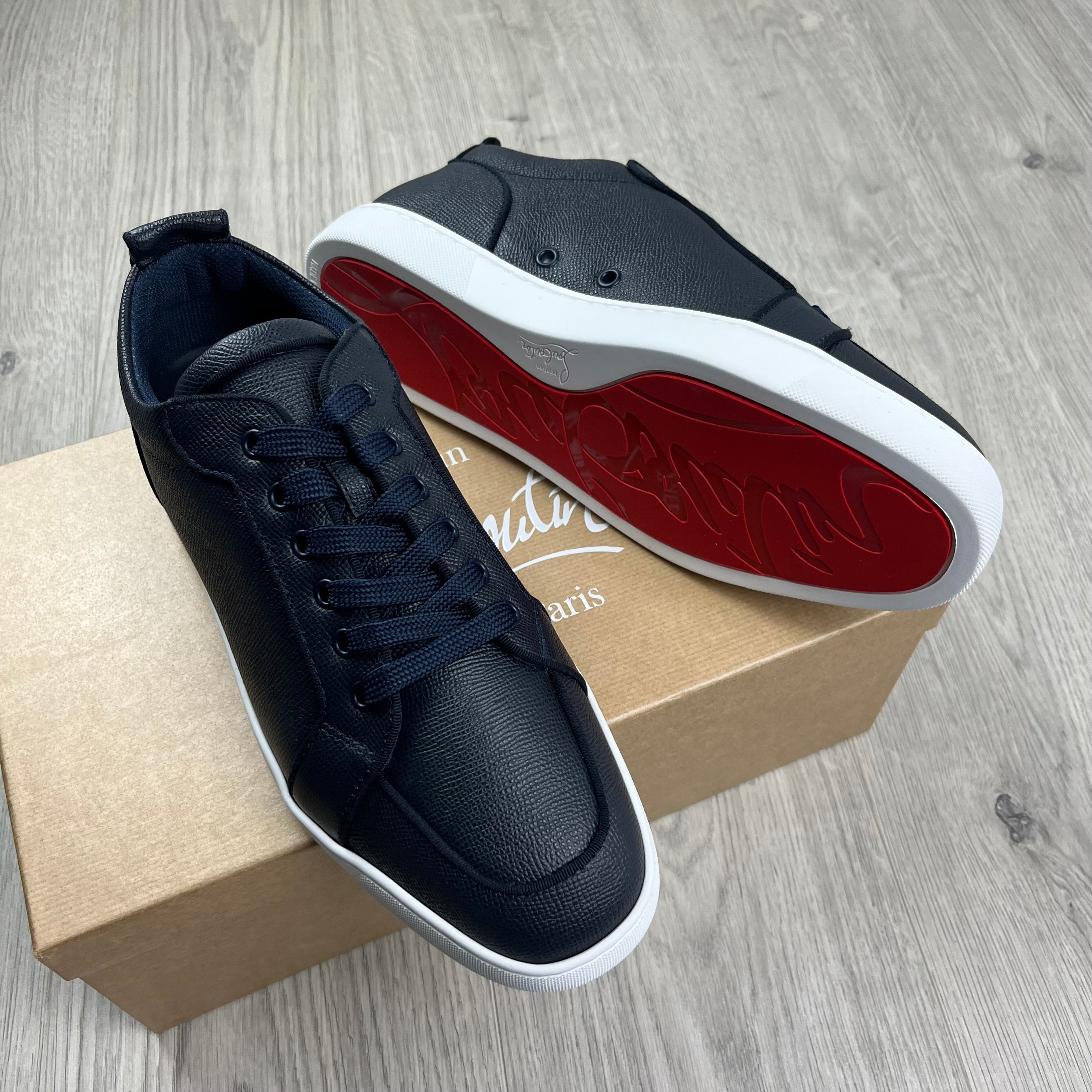 Christian Louboutin Rantulow Sneakers in Navy Marine. On sale at Open Attire.