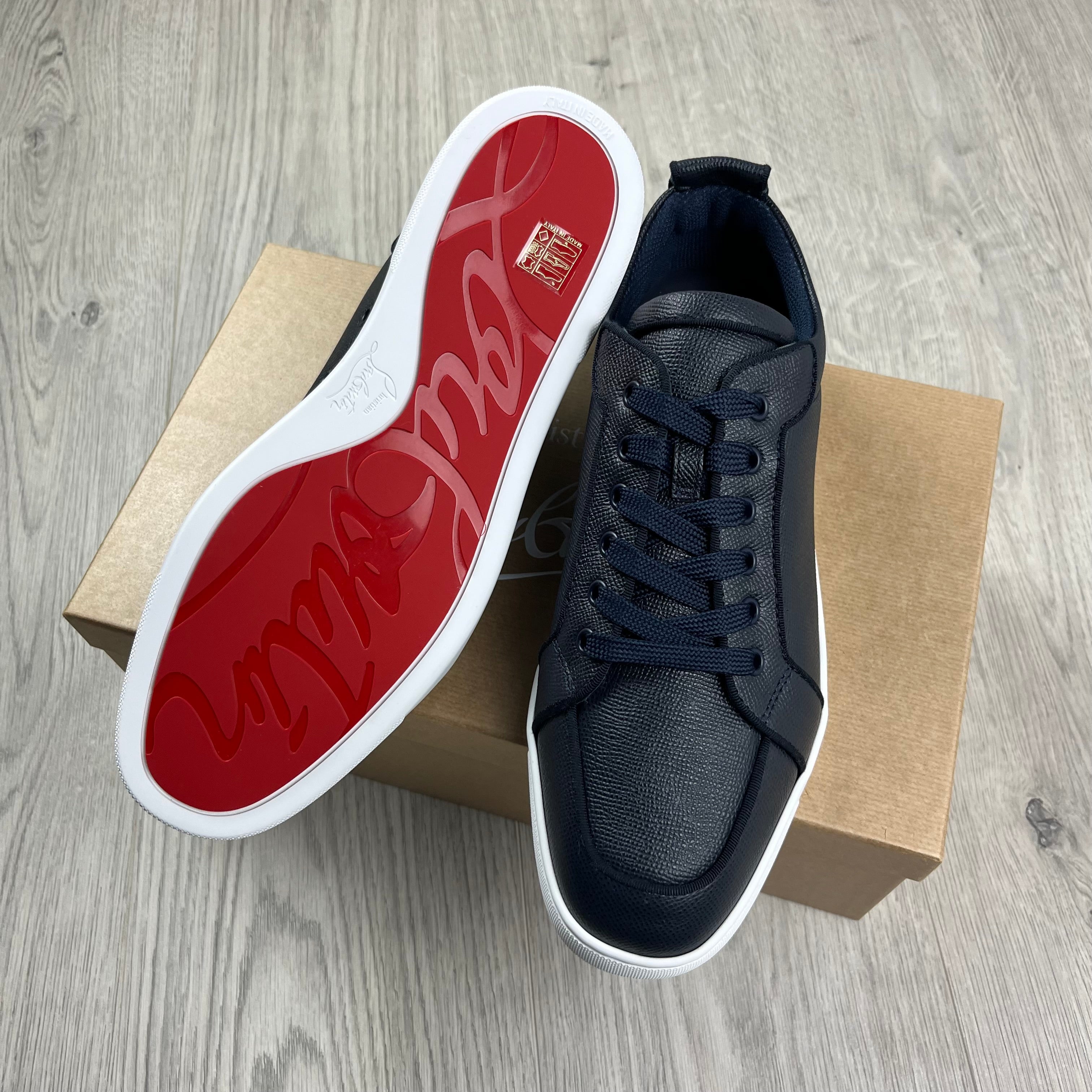 Christian Louboutin Rantulow Sneakers in Navy Marine. On sale at Open Attire.