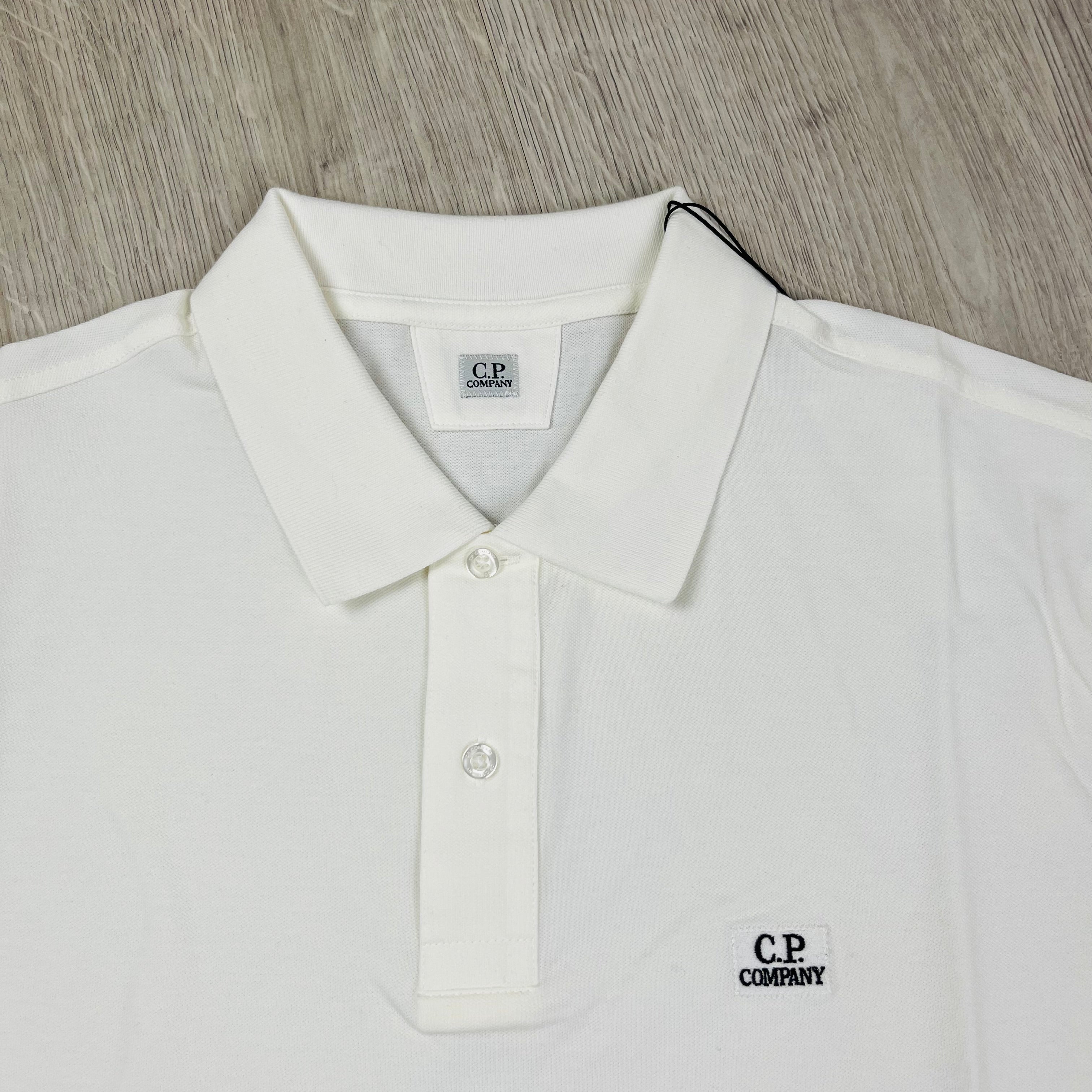 CP Company Polo Shirt in White. On sale at Open Attire.