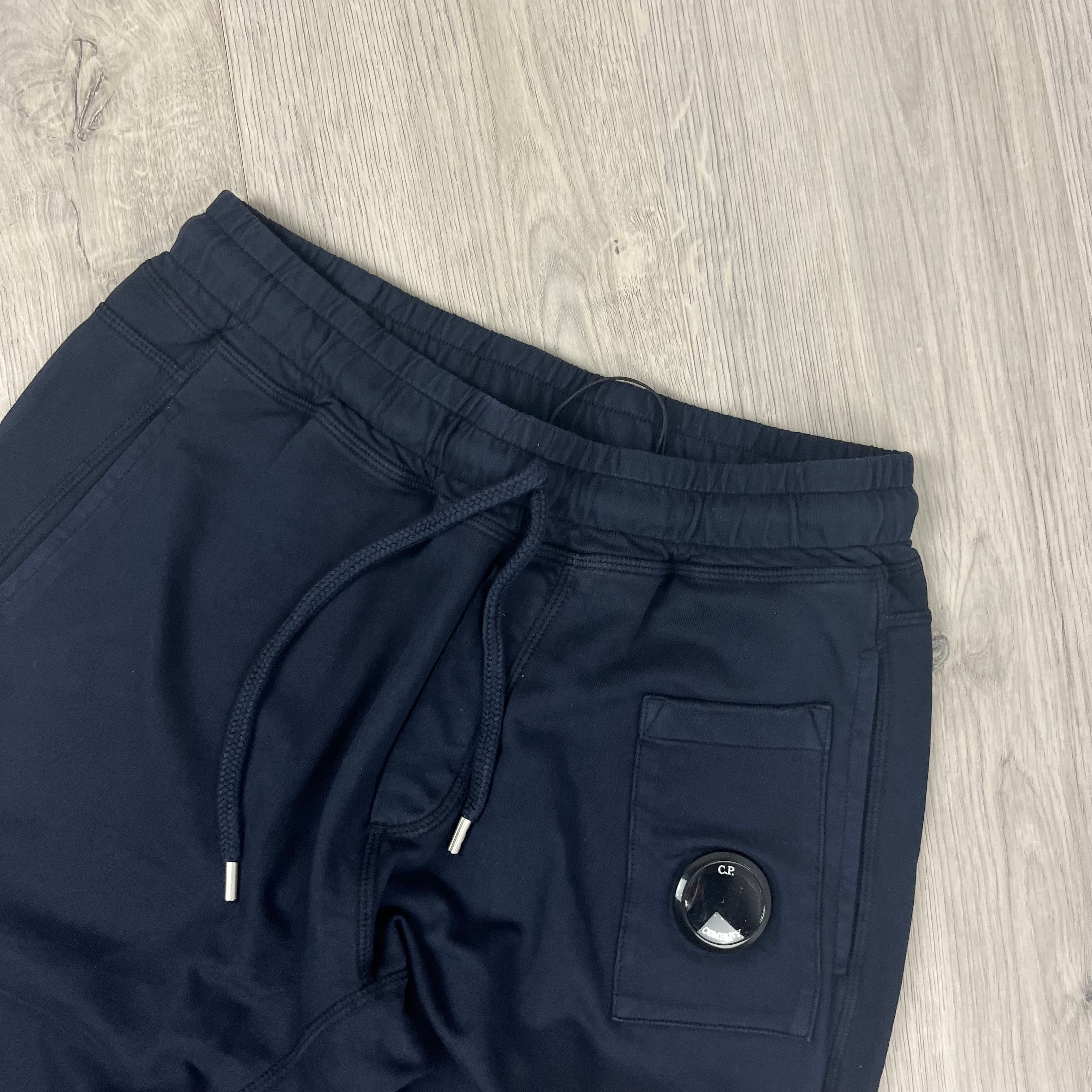 CP Company Utility Sweatpants in Total Eclipse Navy Blue. On sale at Open Attire.