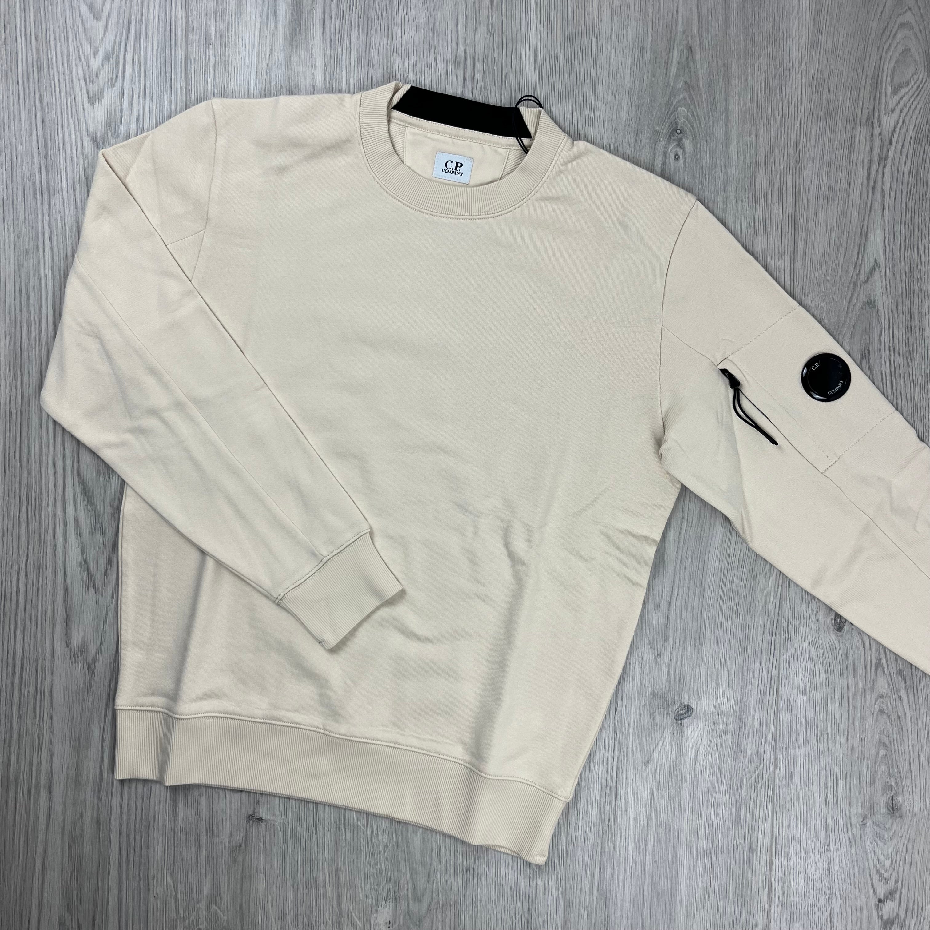 CP Company Diagonal Raised Fleece Lens Sweatshirt in Pistachio Shell. On sale now.