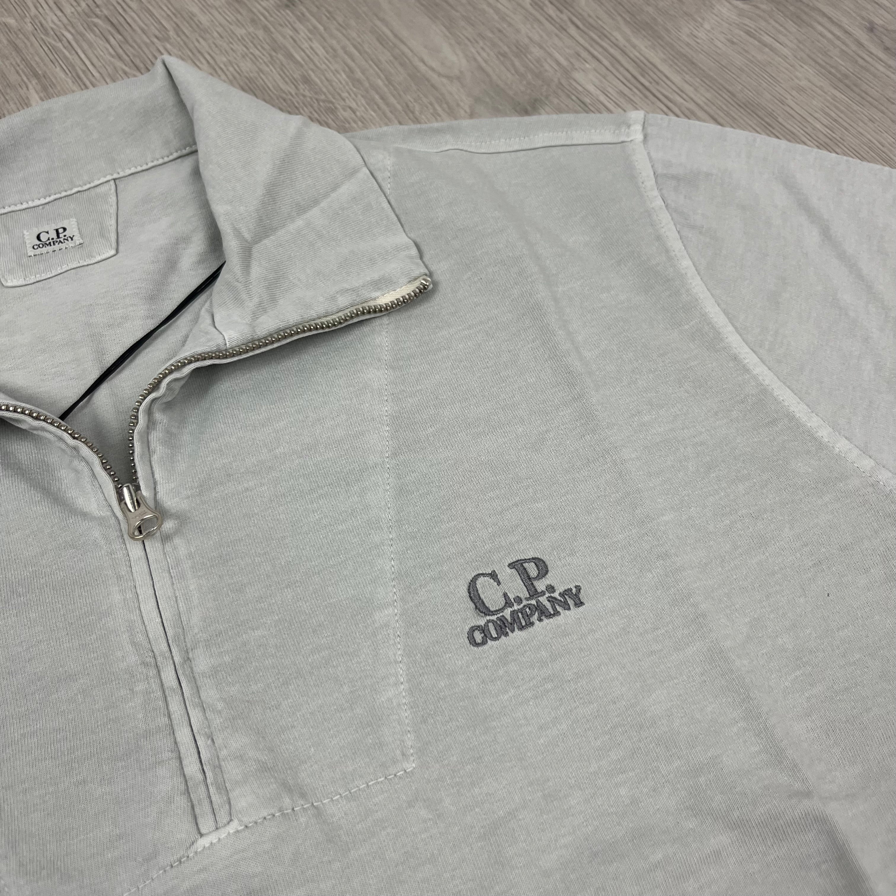 CP Company 1020 Zip Polo Shirt in Blue Fox. On sale at Open attire.