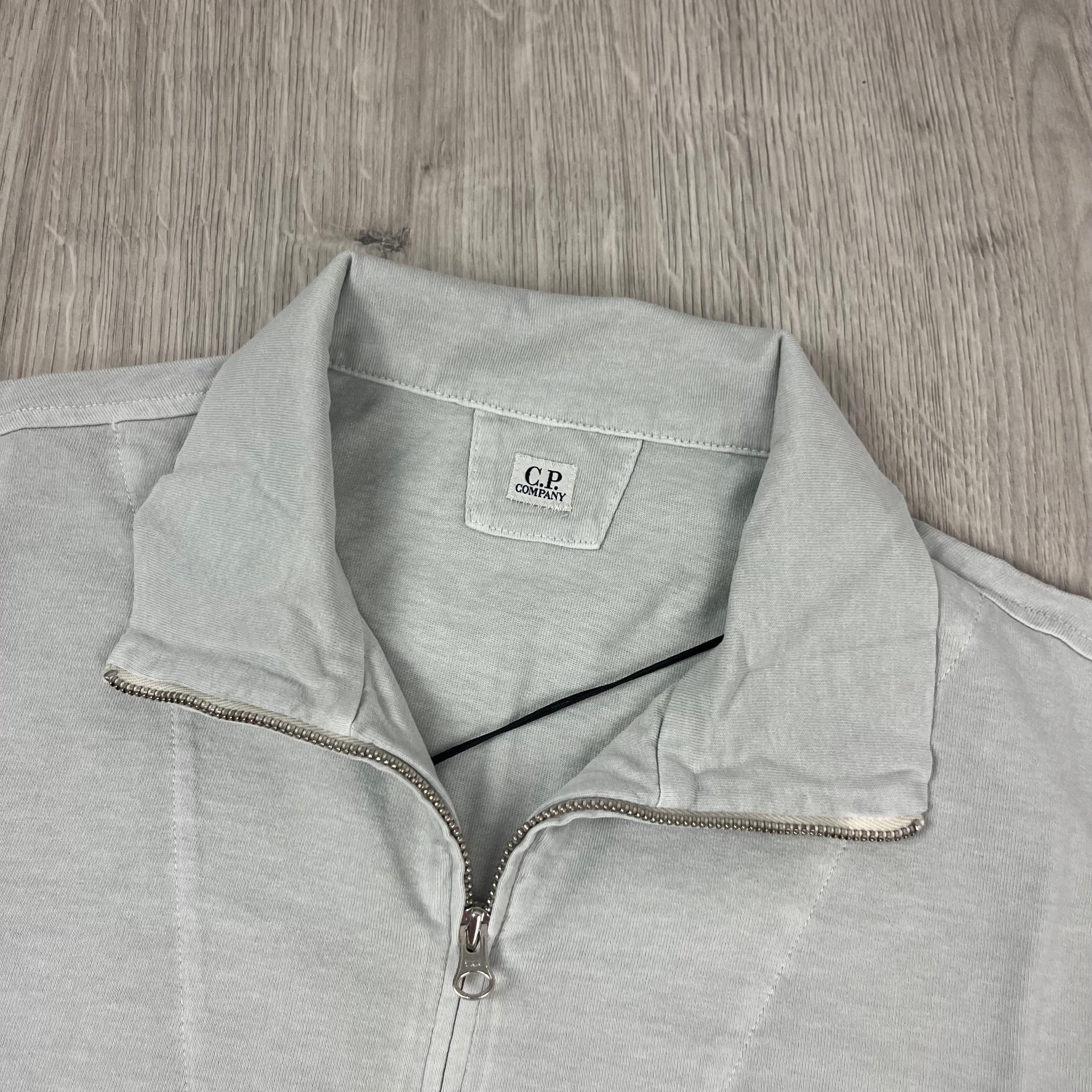 CP Company 1020 Zip Polo Shirt in Blue Fox. On sale at Open attire.