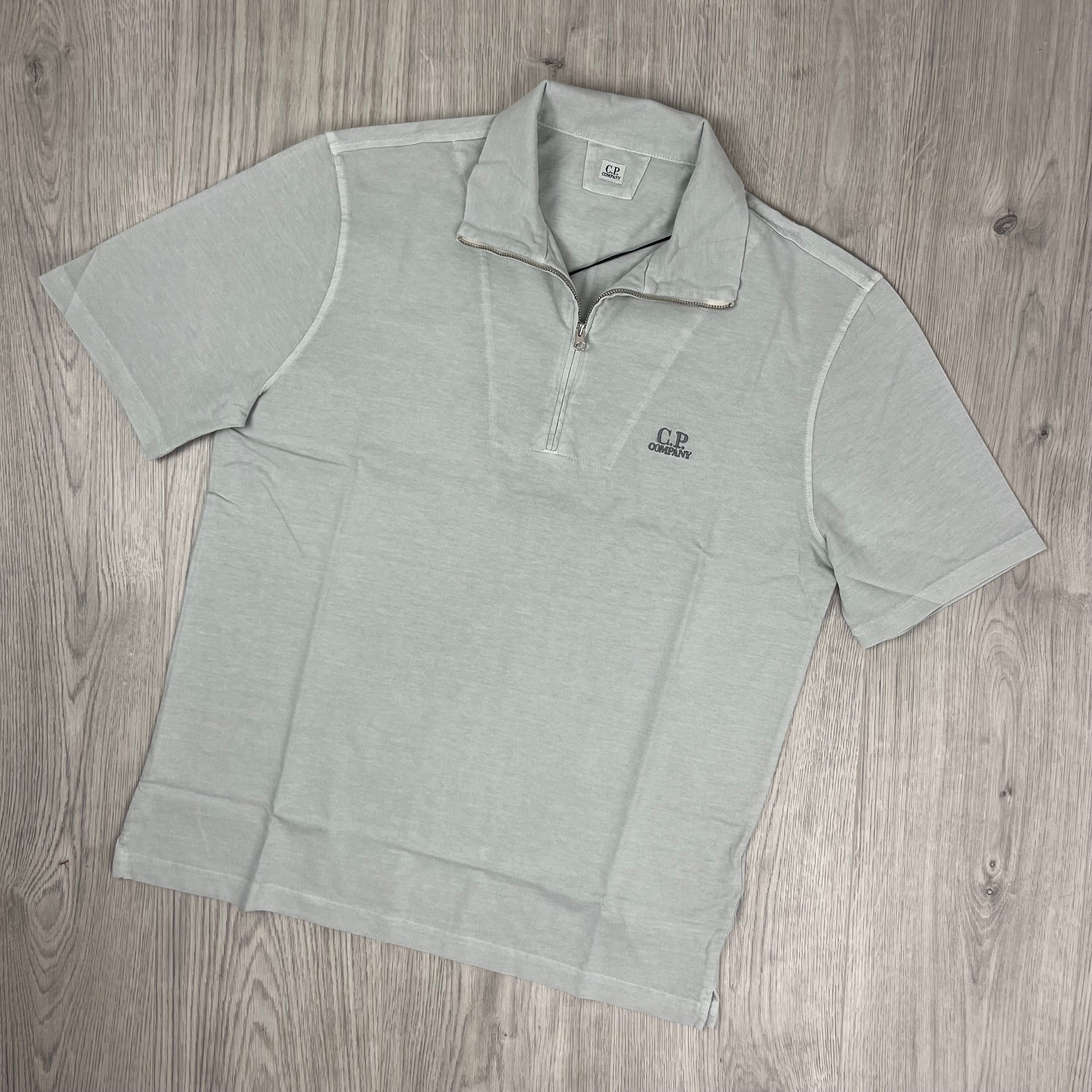 CP Company 1020 Zip Polo Shirt in Blue Fox. On sale at Open attire.