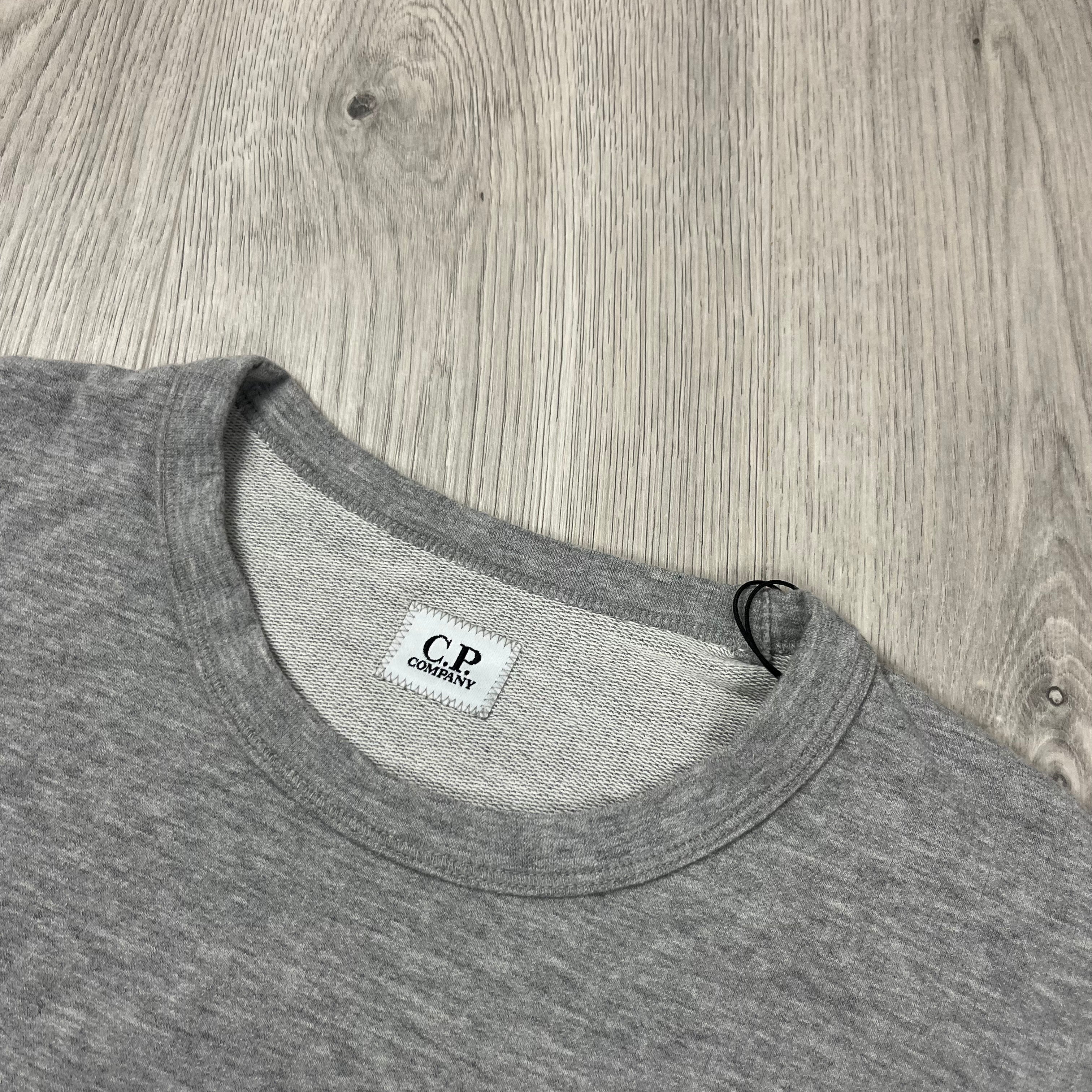 CP Company Light Fleece Sweatshirt in Grey Melange. On sale at Open Attire.