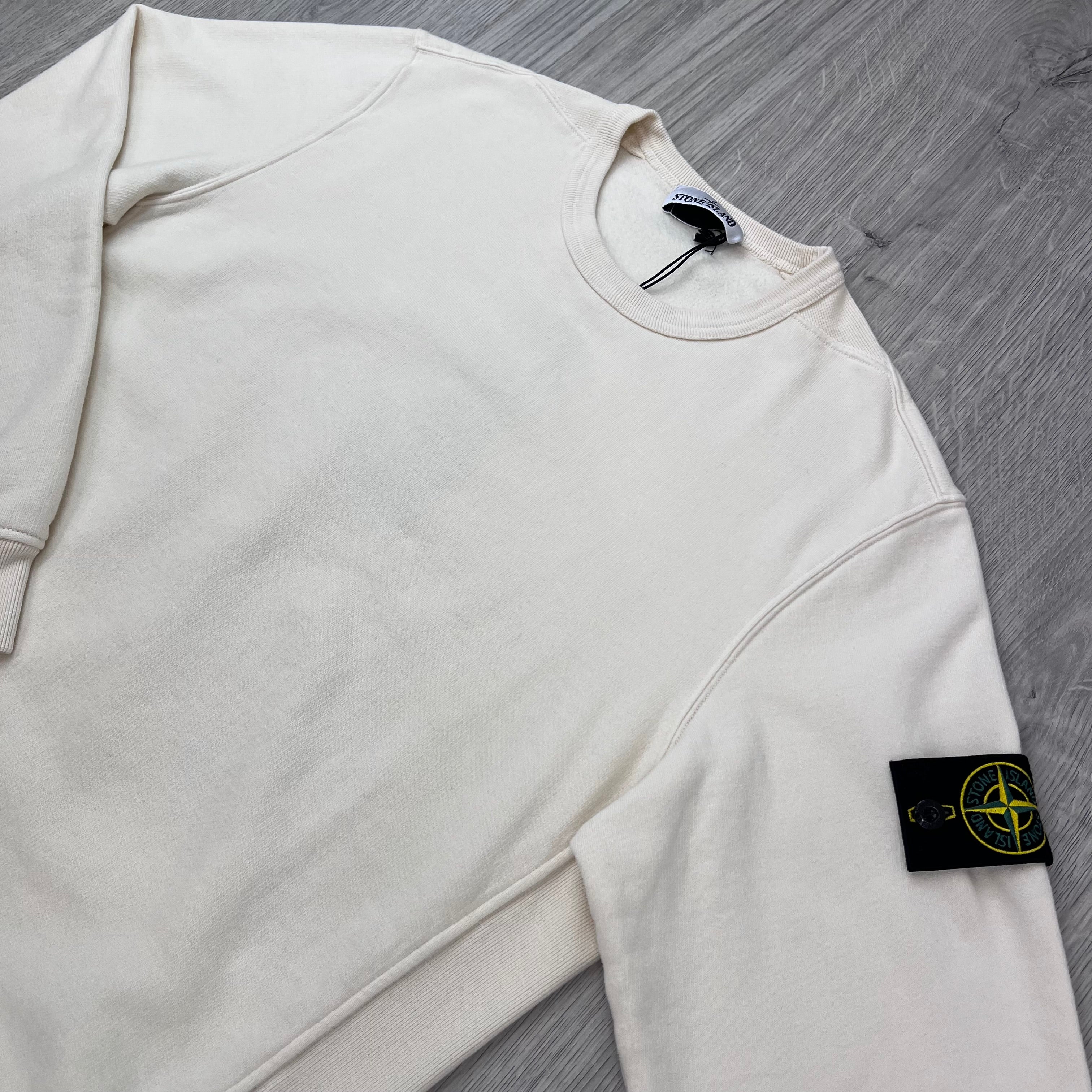Angled view of the Stone Island Crewneck Brushed Cotton Sweatshirt in Ivory.