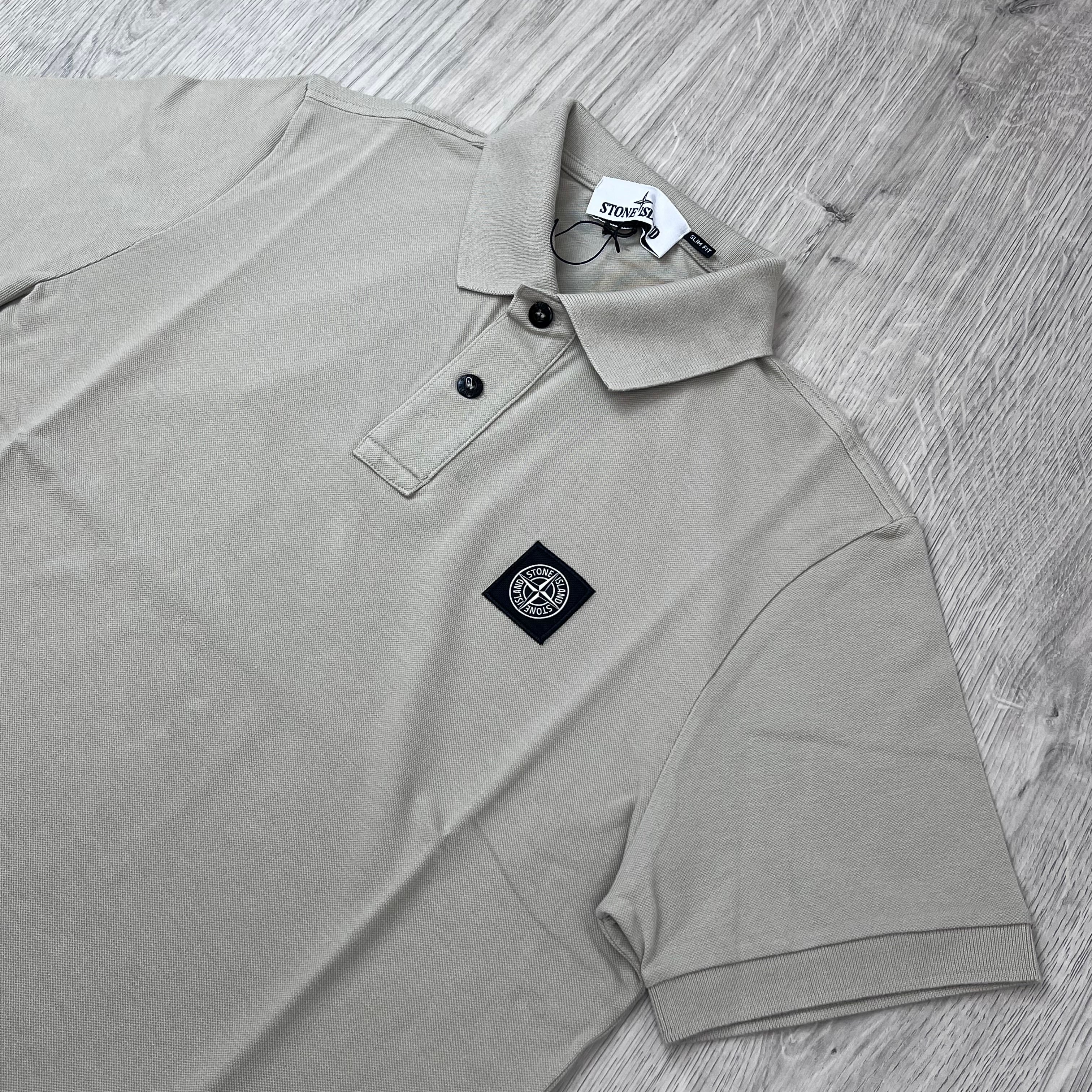 Angled view of the Stone Island Patch Polo Shirt in Sand.