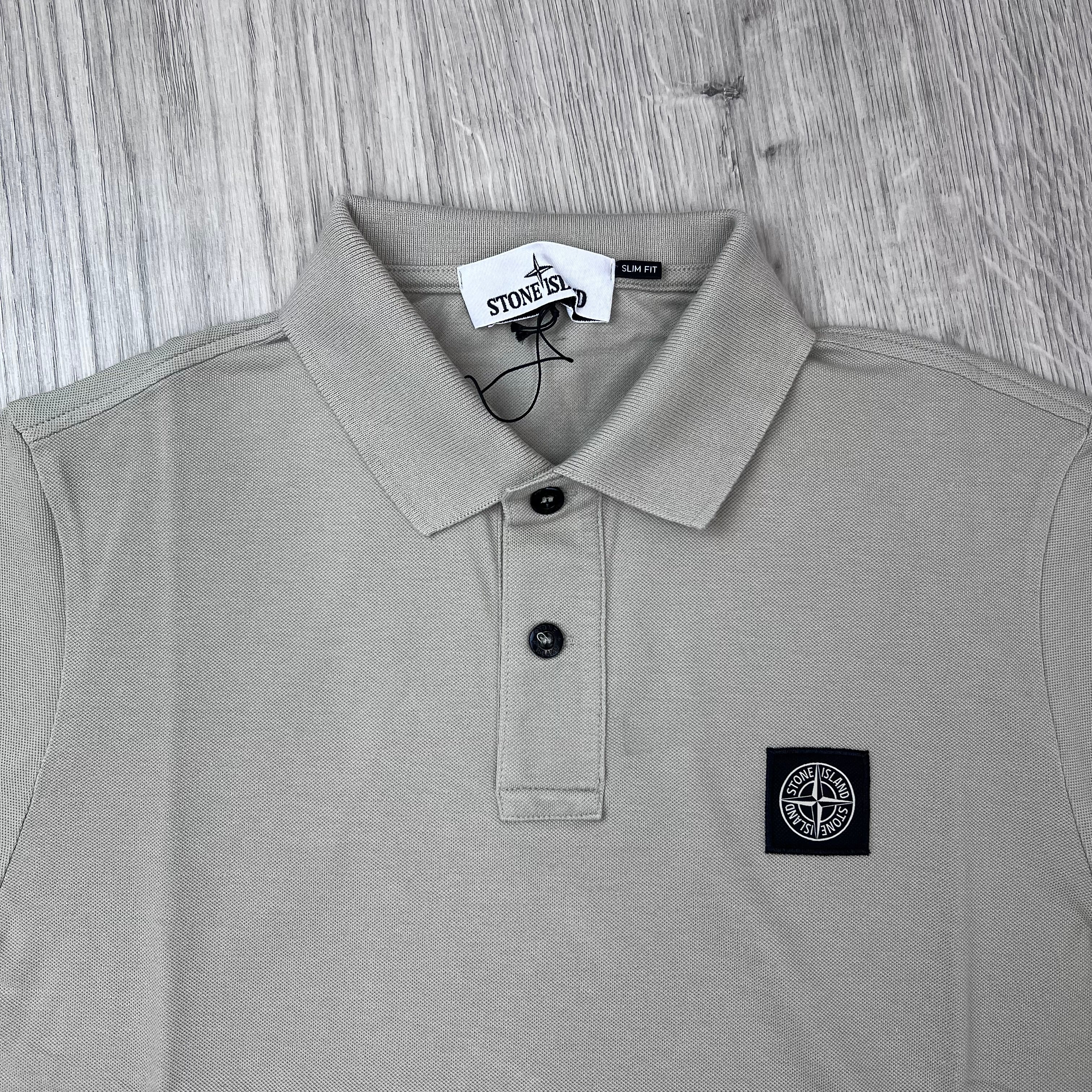 A close up front view of the Stone Island Patch Polo Shirt in Sand.