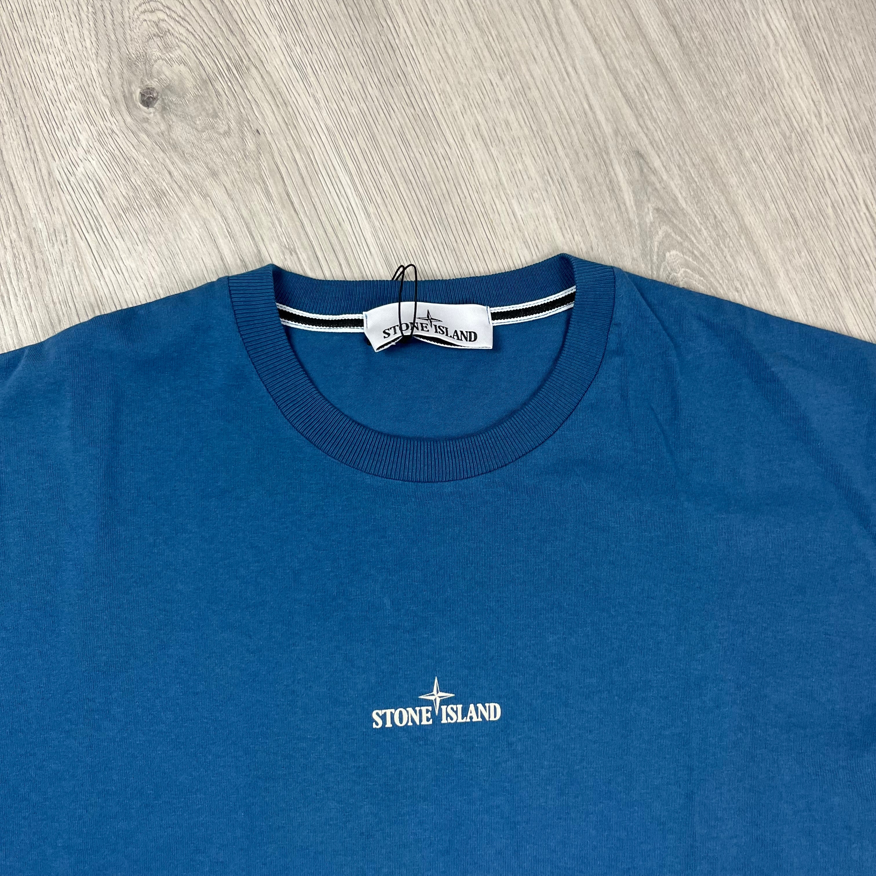 Stone Island 'Institutional Four' T-shirt in Avio Blue. On sale at Open Attire.